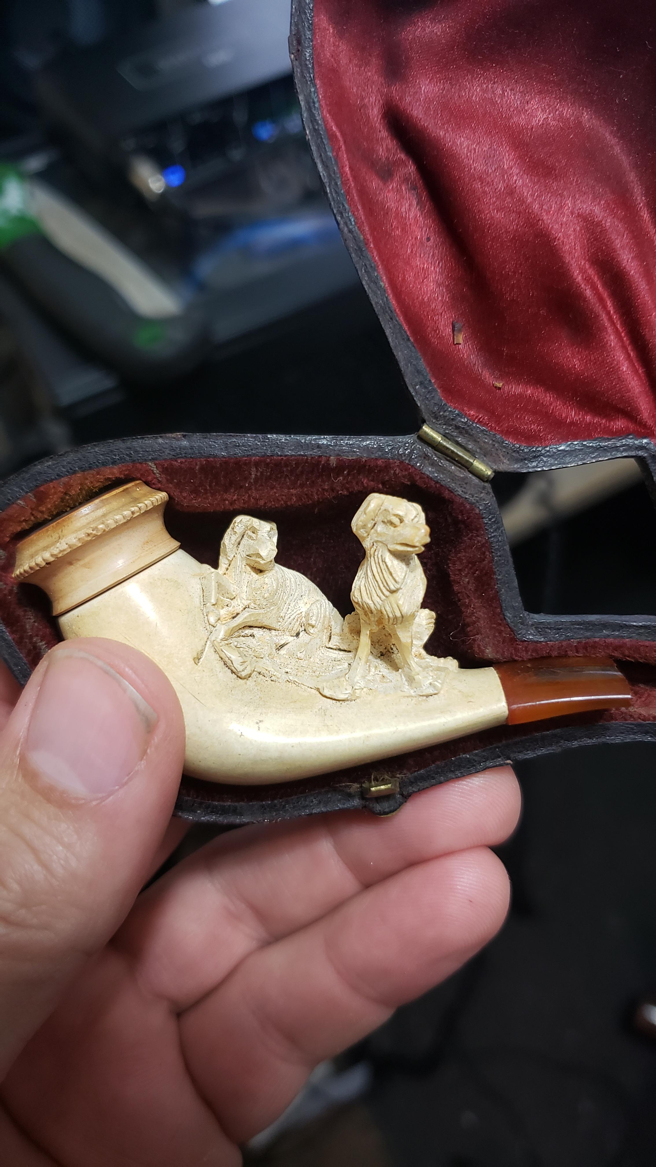 [OC] my great grandfather's tiny ivory pipe carved with wolves r