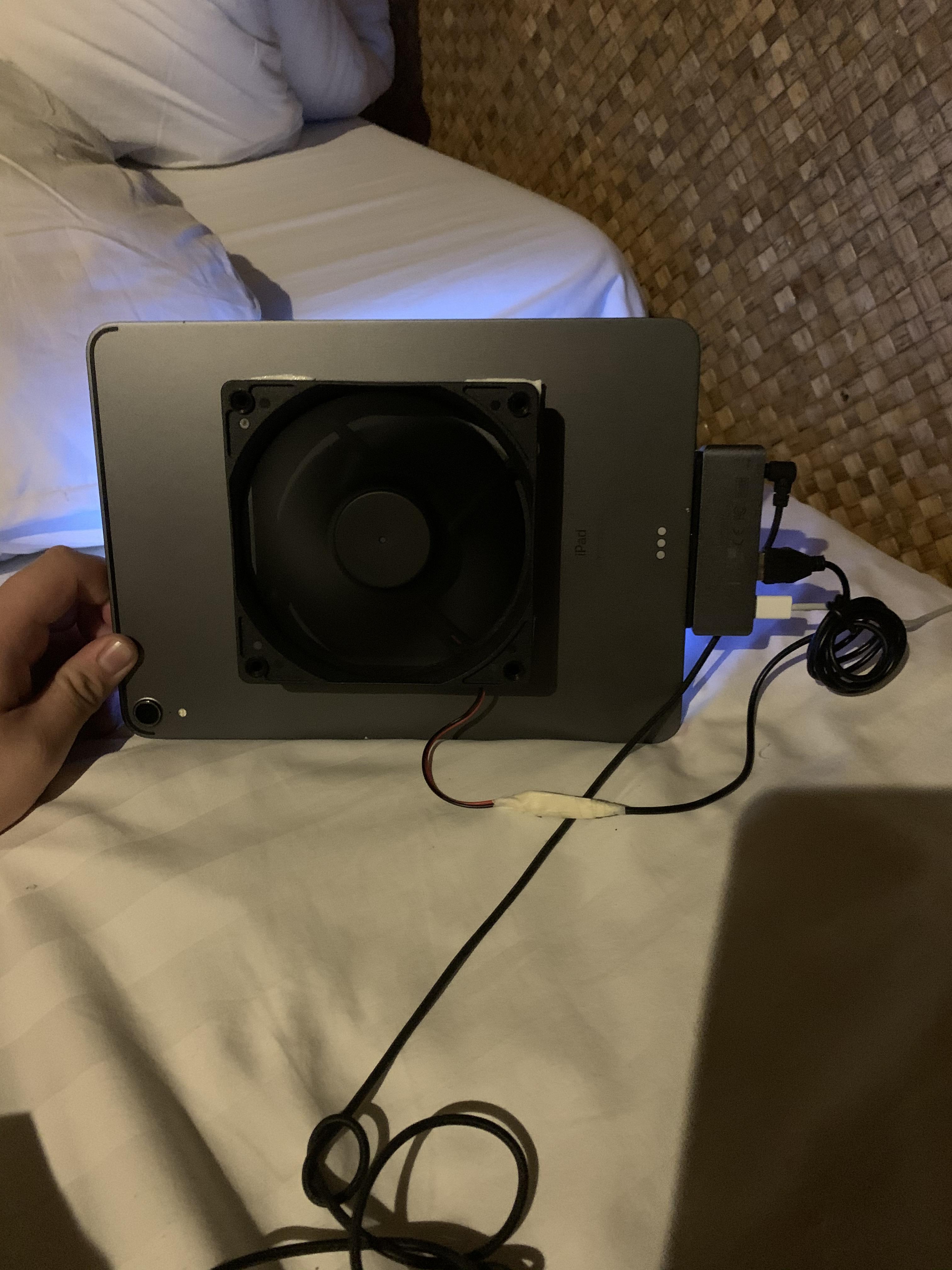 So this is how I cool down my iPad I use a pc cooler fan and it works