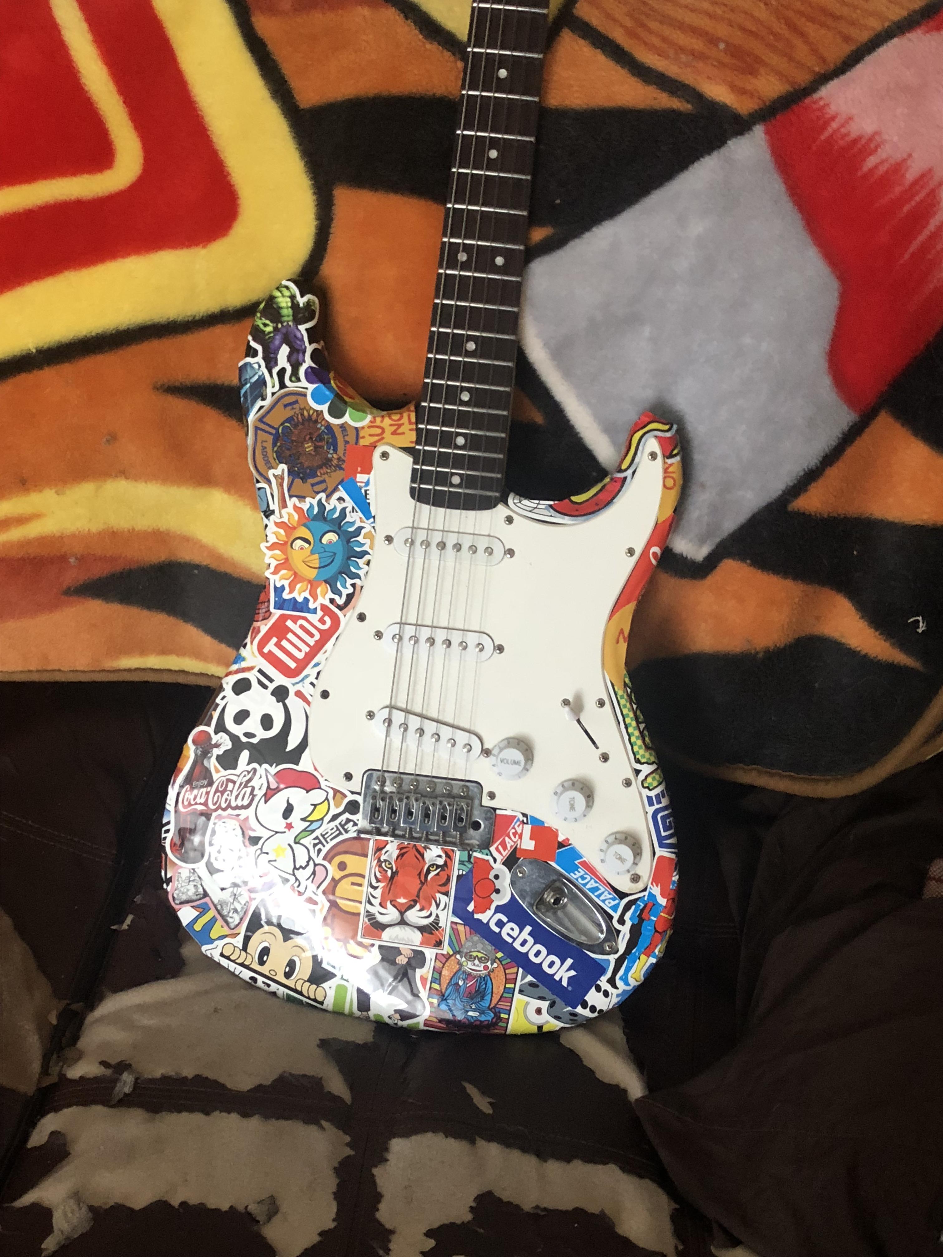 I put 150 stickers on my strat, what do u think r/guitars