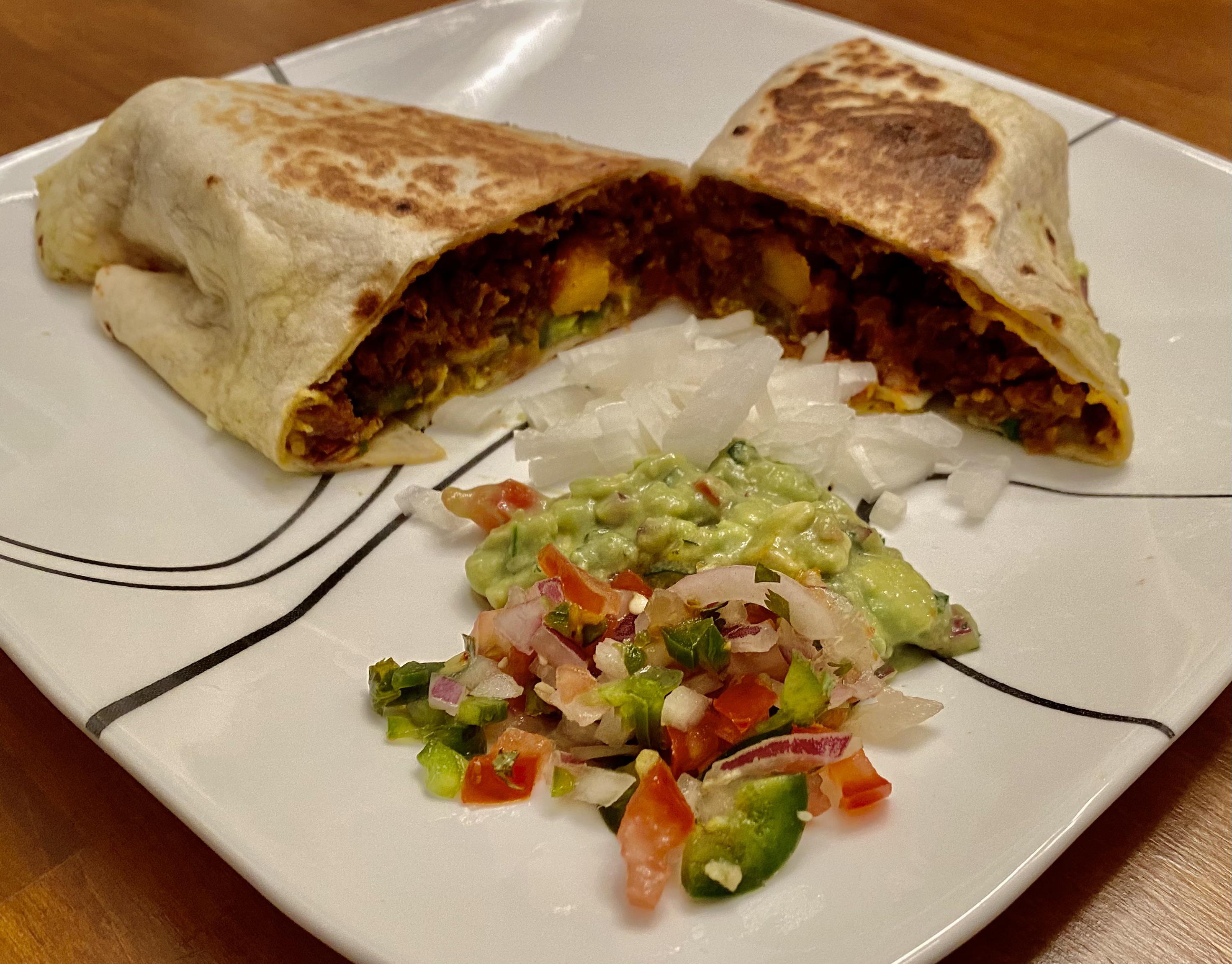 Chorizo con Papas Burrito with Carolina Reaper salsa verde, pico de