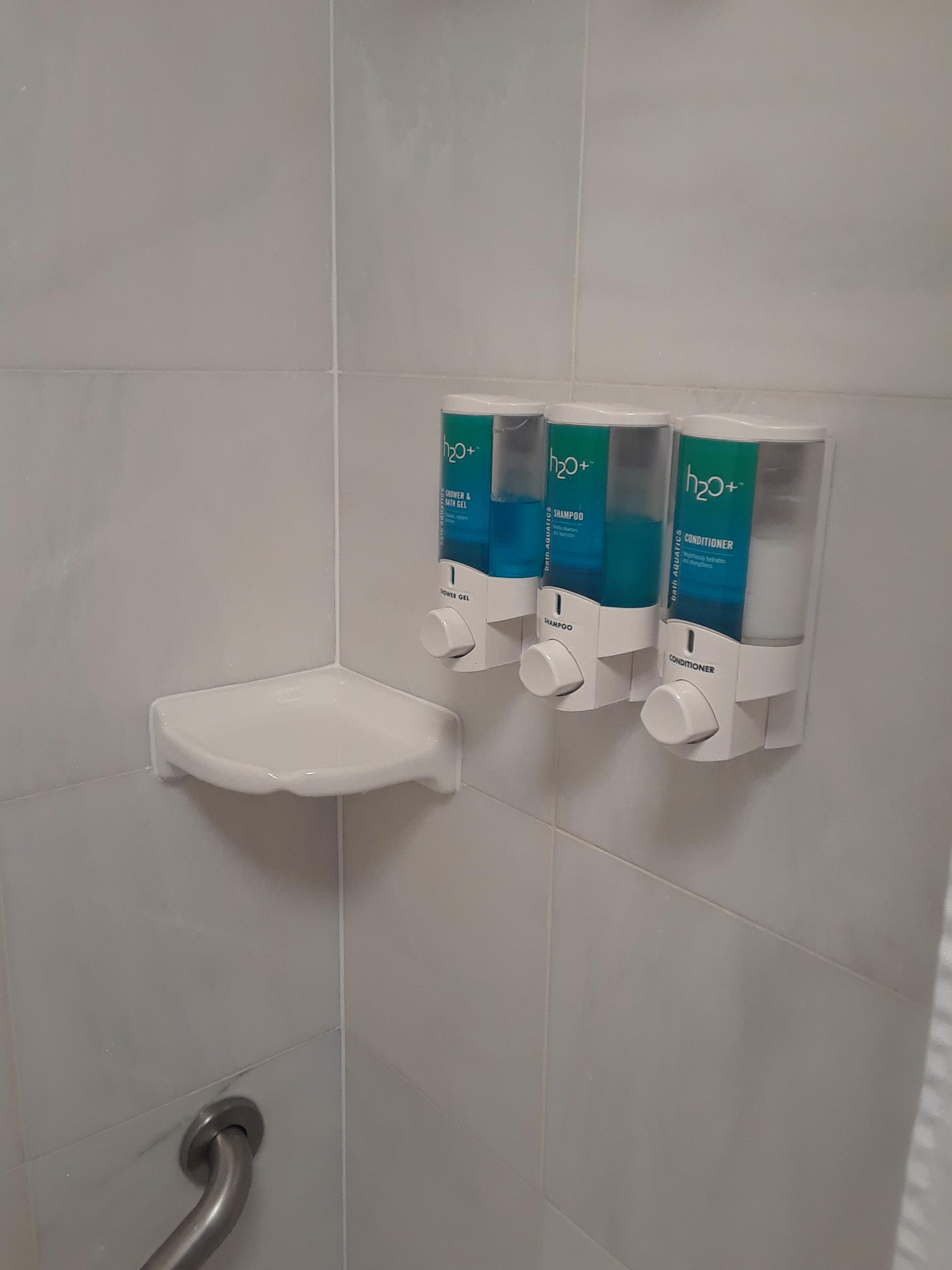My hotel room has dispensers for your shower soaps instead of little