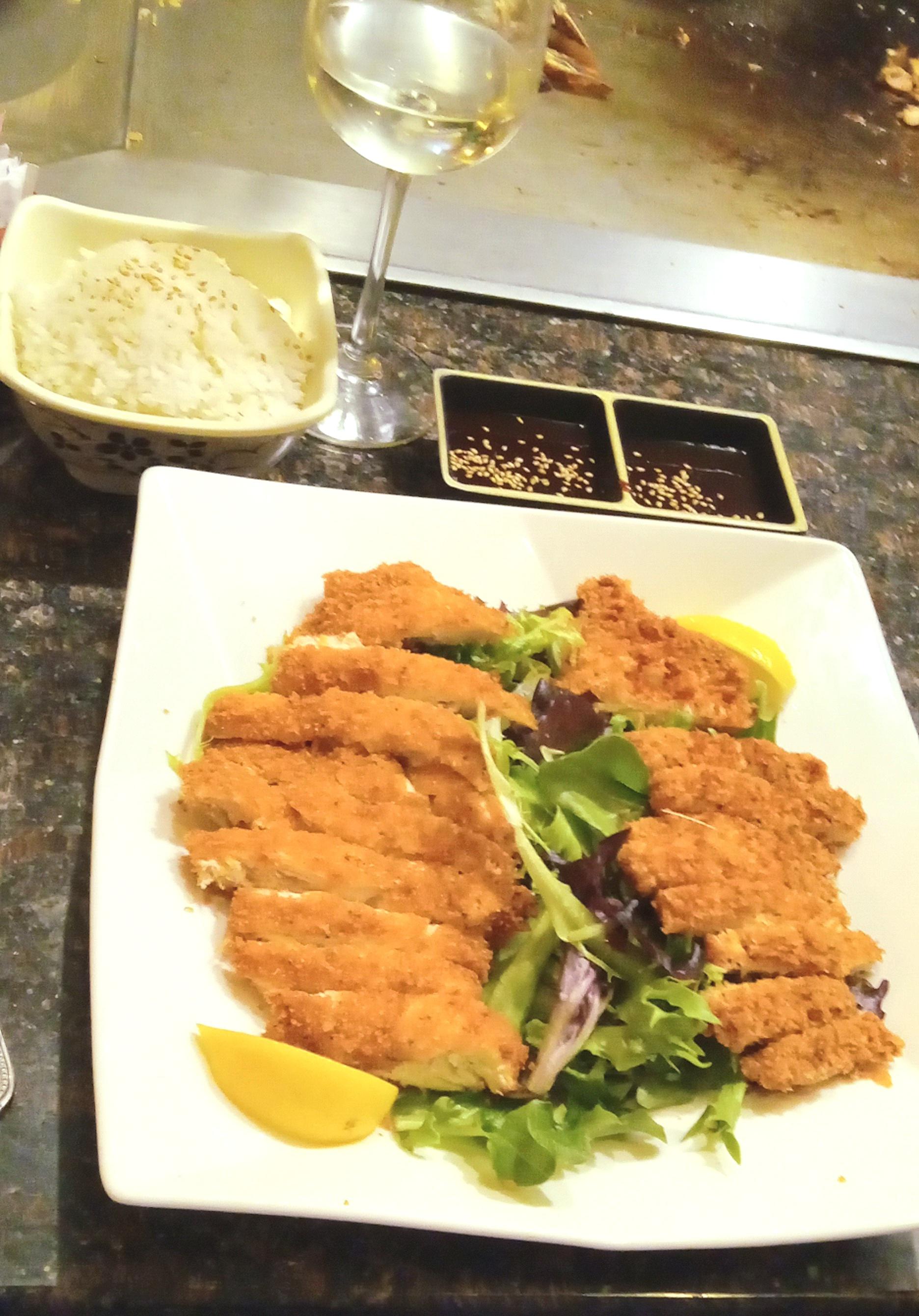 Chicken Katsu over greens with rice and katsu sauce Hayashi Japanese