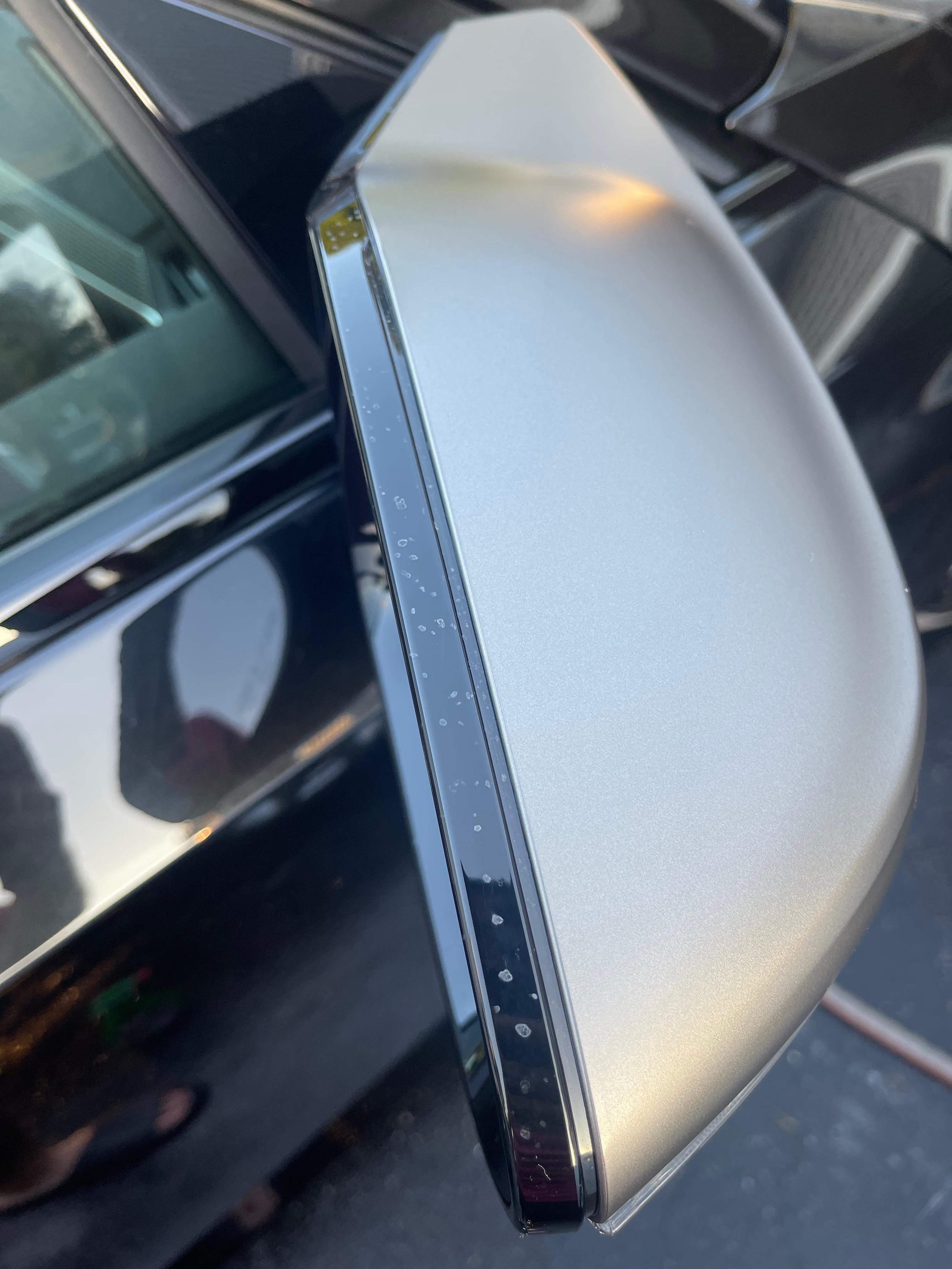 Strange white spots on side mirror? Detailing
