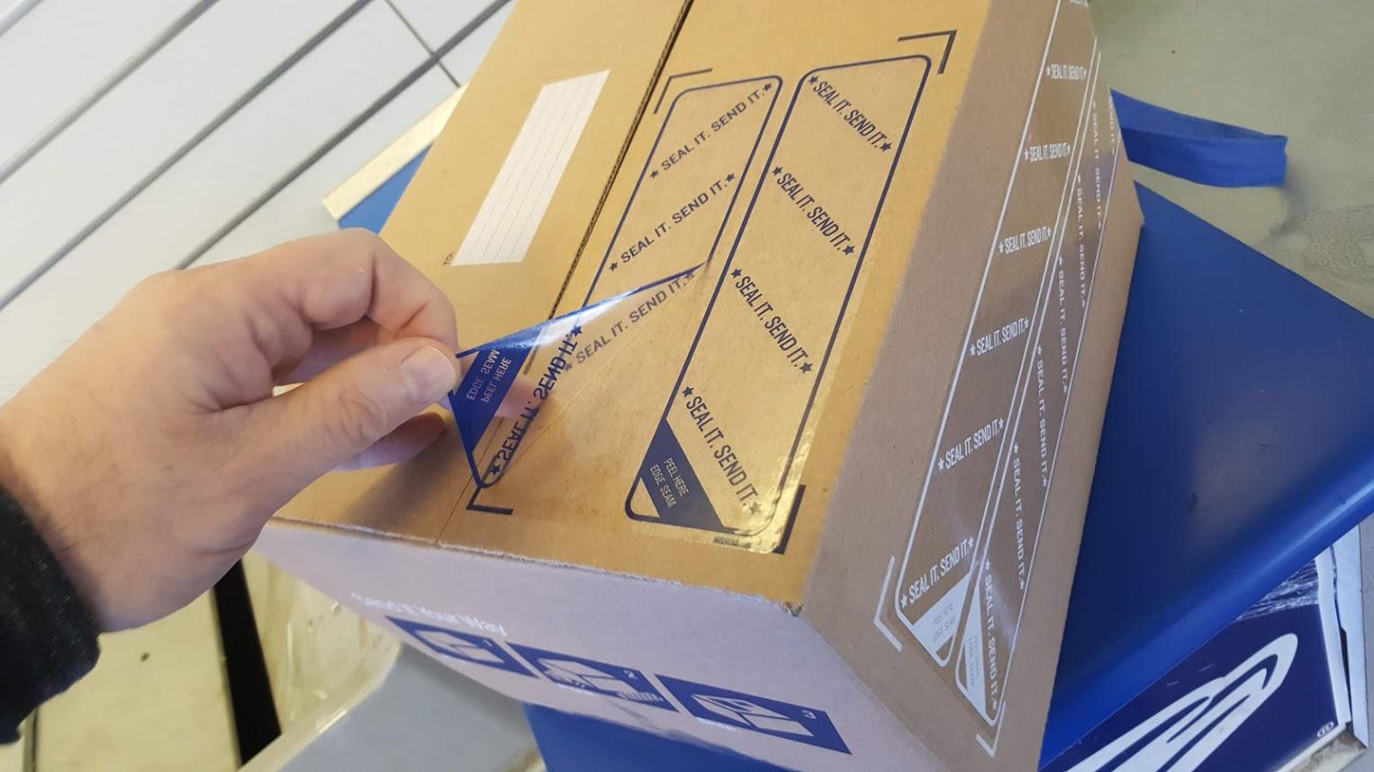 These new boxes at the post office come with sealing tape r