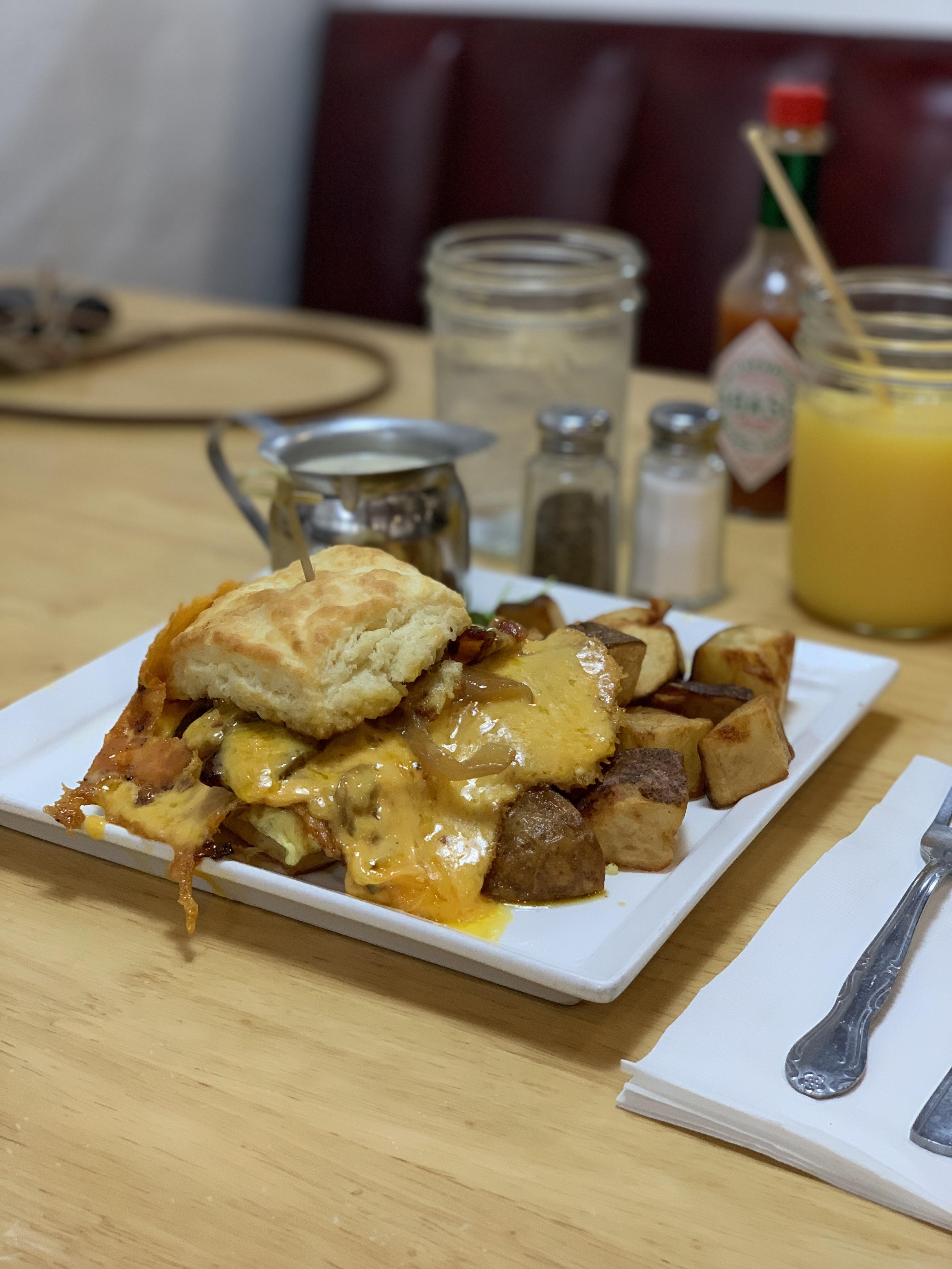 [I ate] Biscuit sandwich with bacon, egg, caramelized onions, cheddar