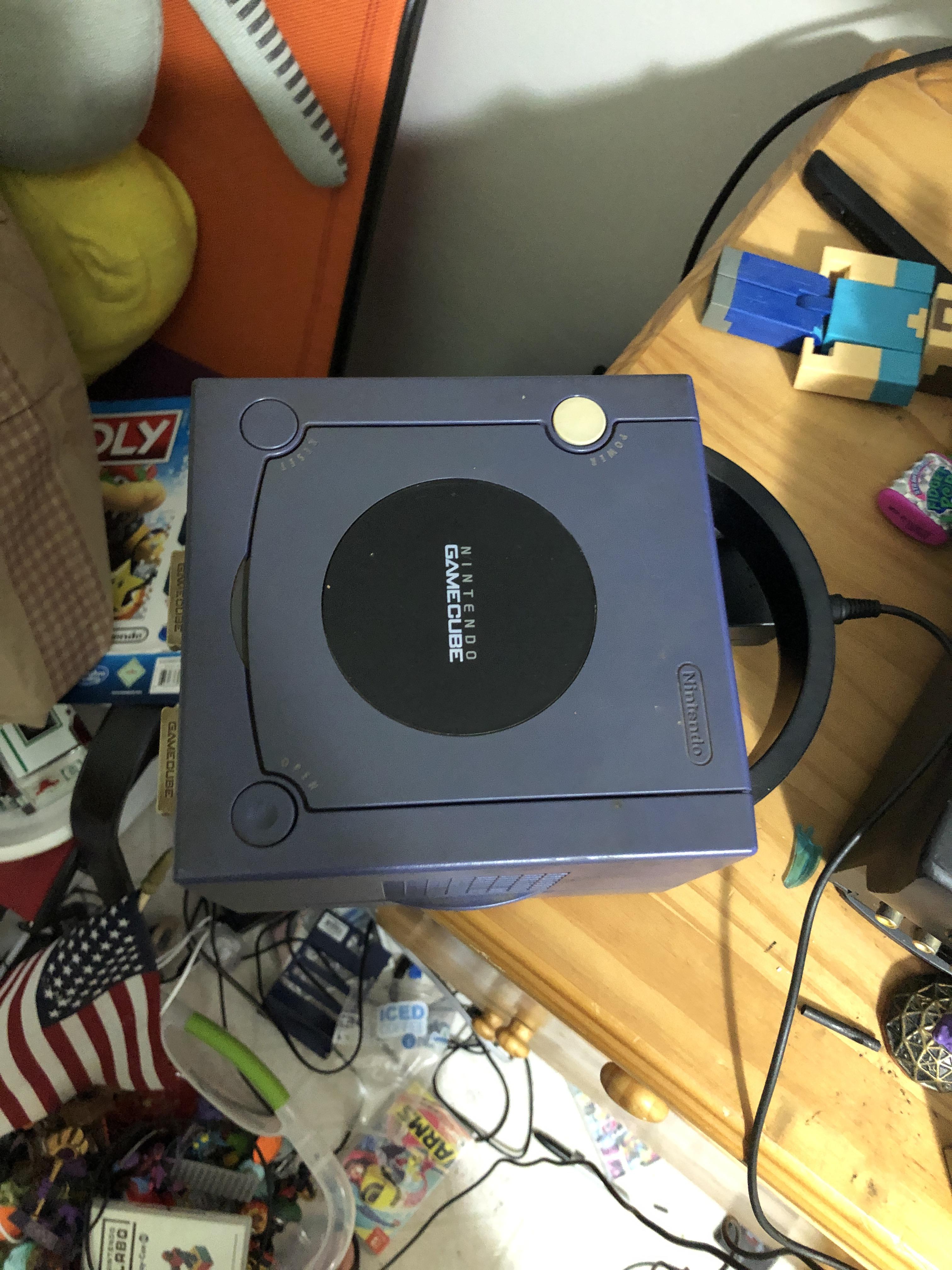 My GameCube setup. 2 memory cards, an RF modulator (for an N64) hooked