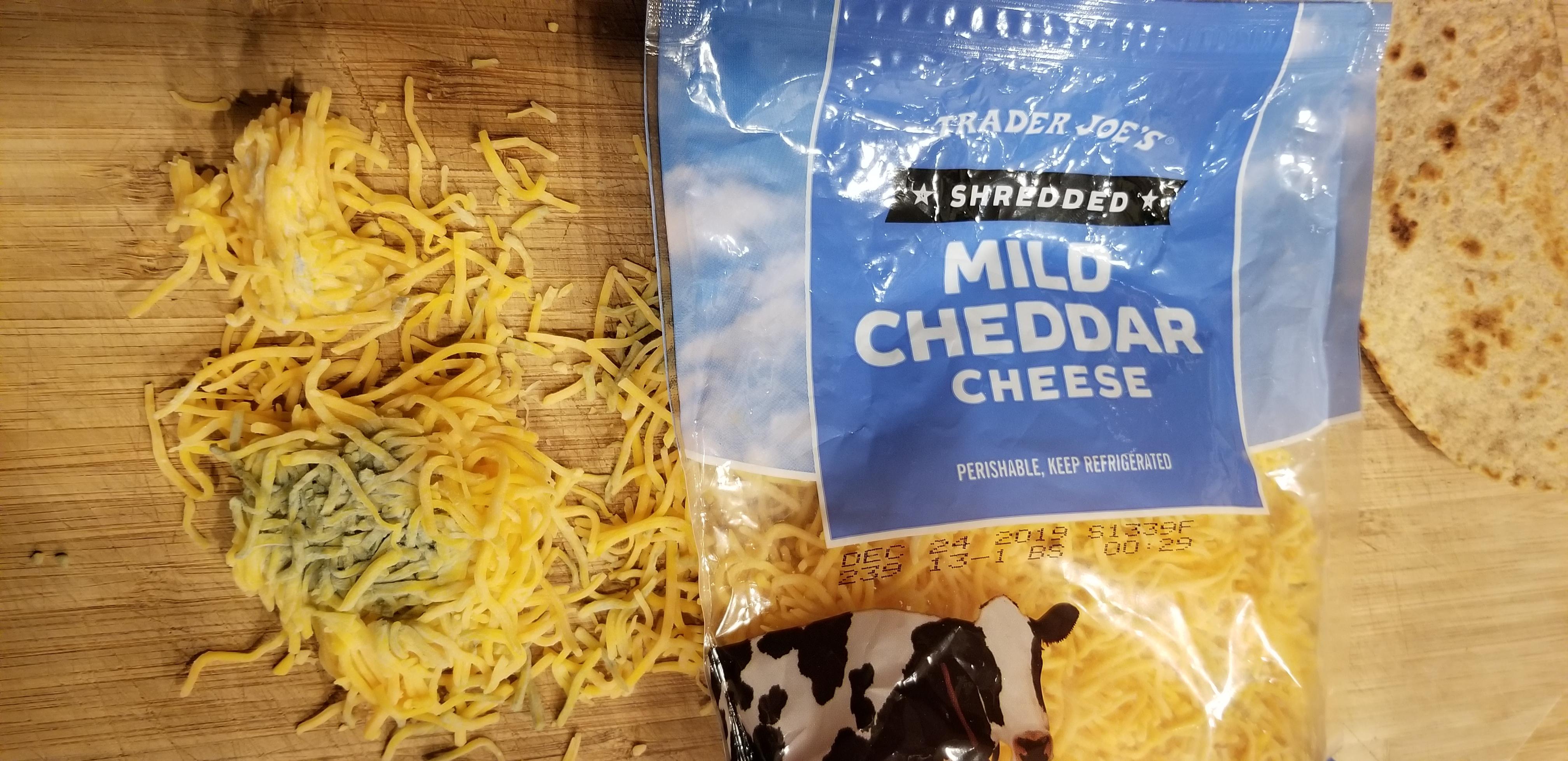 What is this gross discolored mass in my bag of processed cheese? Not the first time I've seen