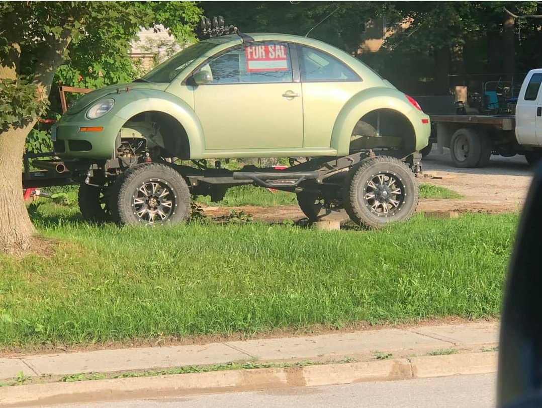 A lifted volkswagen beetle. r/Shitty_Car_Mods
