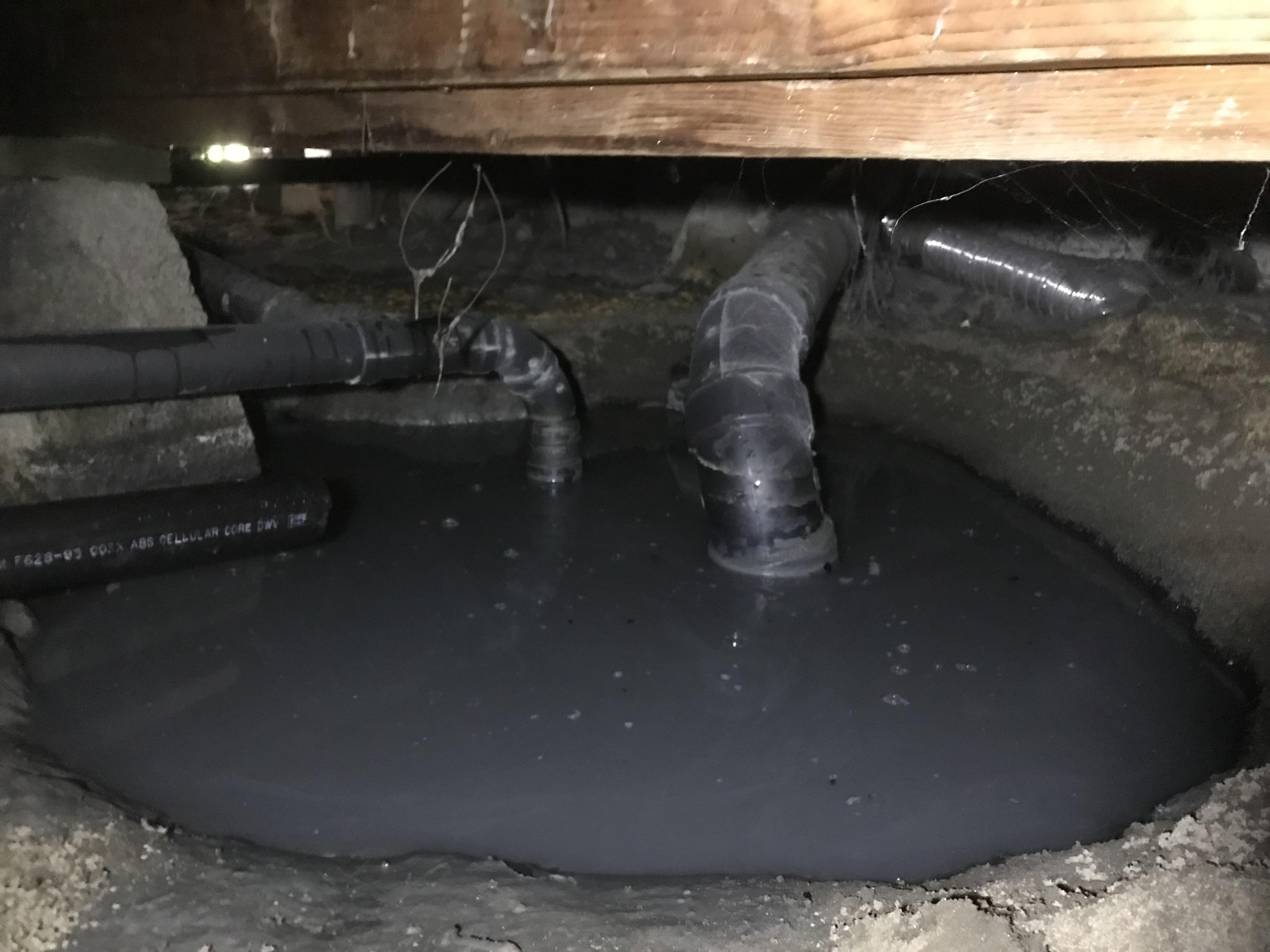 huge puddle of gooey water under a house, sure its been leaking for
