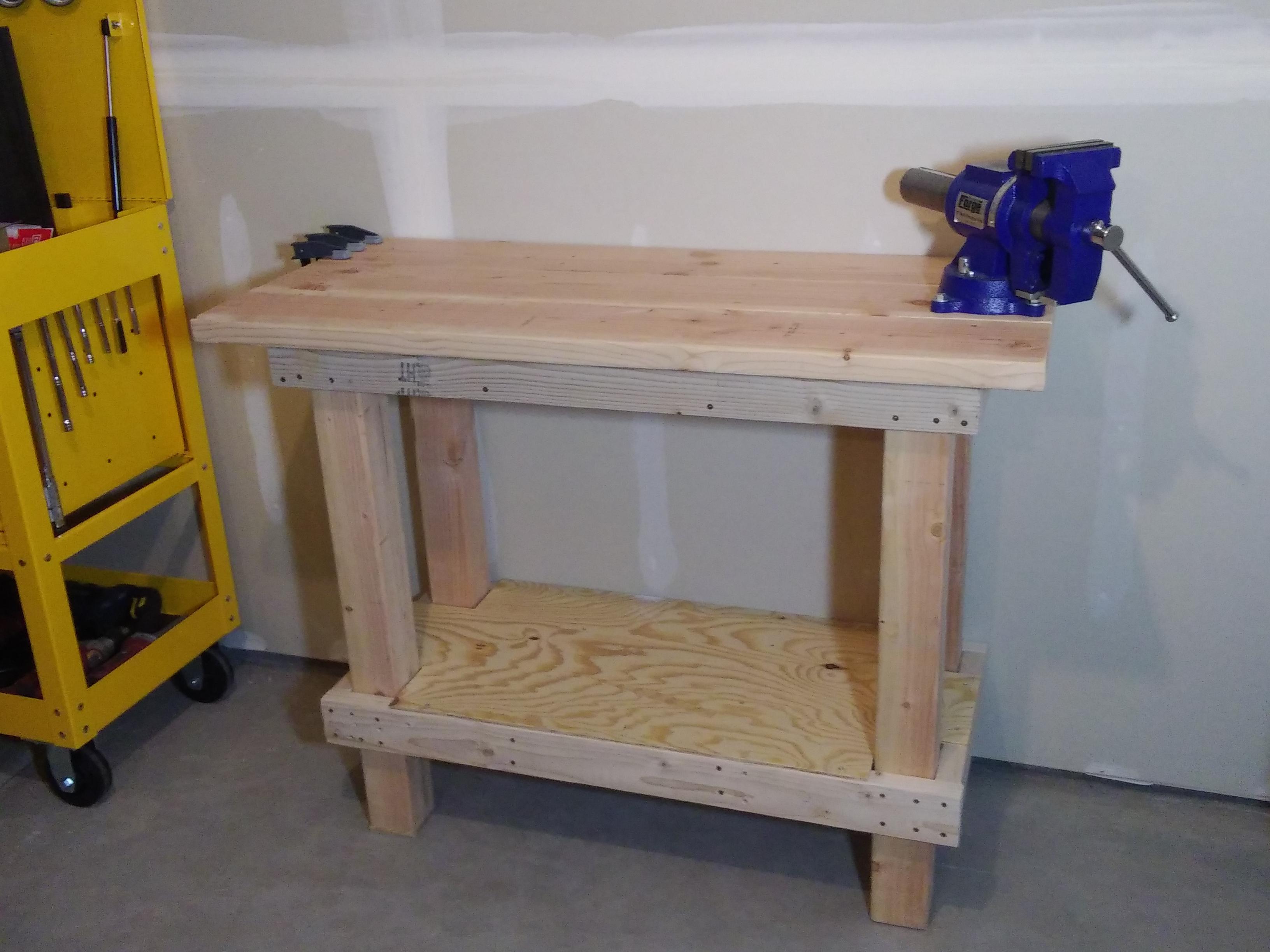My first workbench. Cheap lumber from Lowe's, but it's built like a tank. r/Workbenches