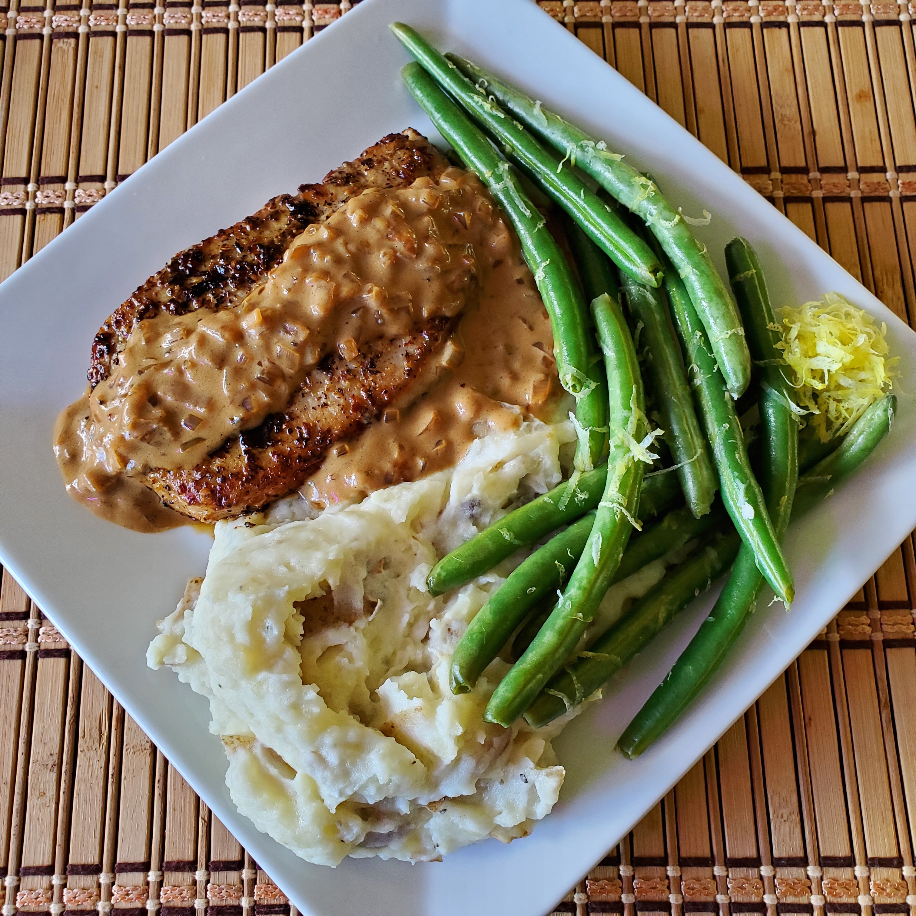 Steakhouse pork chops with a creamy shallot pan sauce & Lemony green