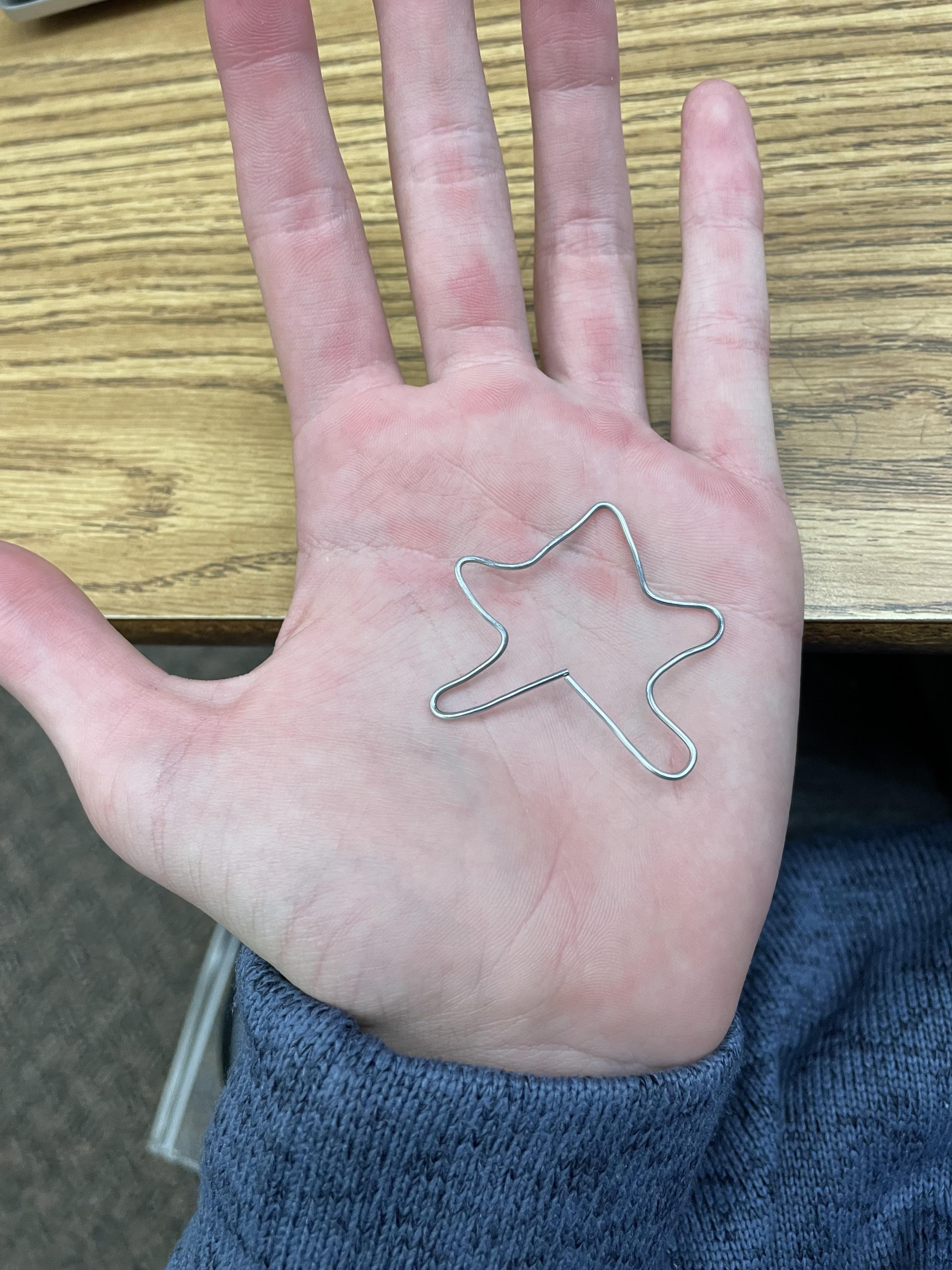 I tried bending a paper clip into a star, and now my fingers hurt. r