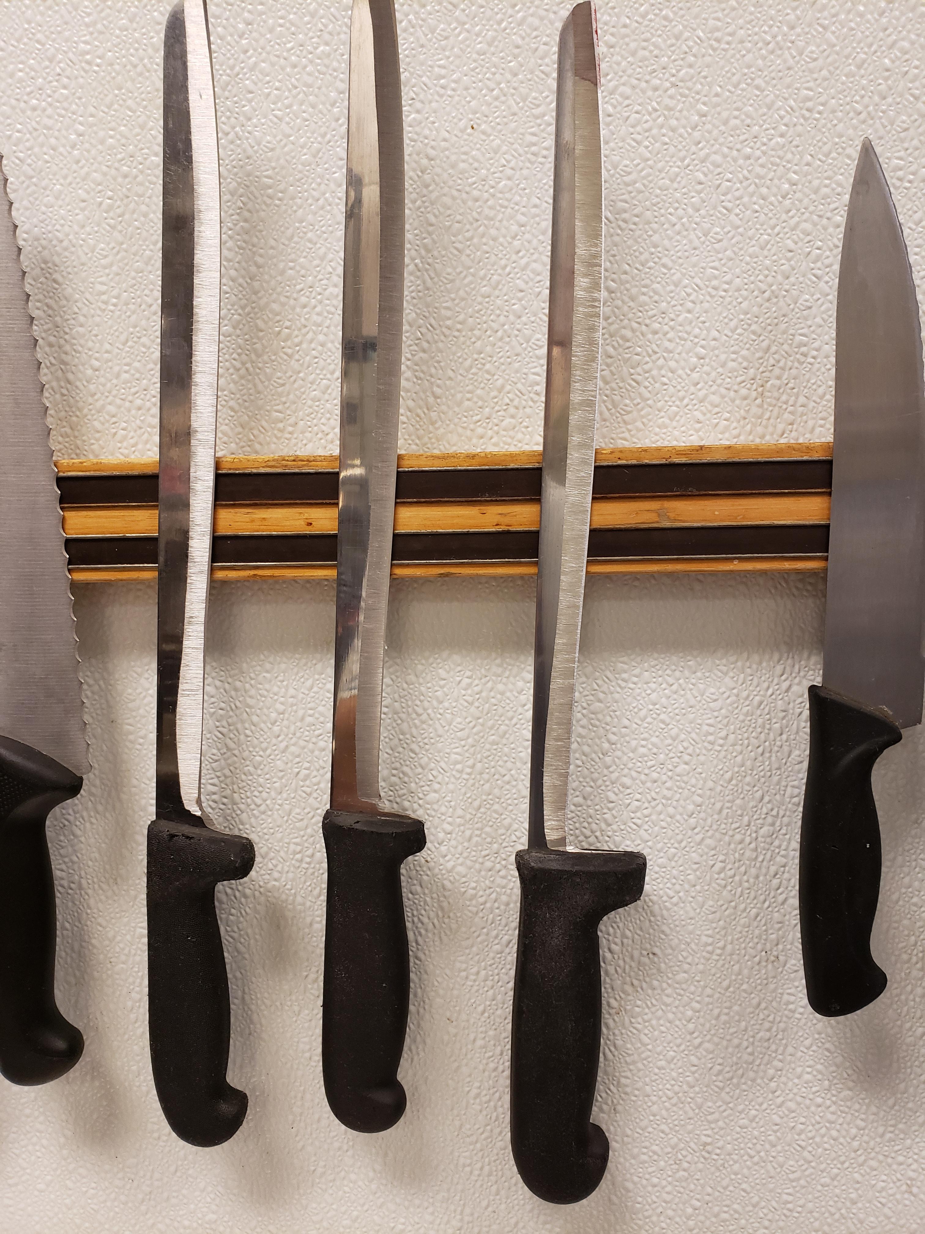 These knives at my work have been used so much they're almost gone.