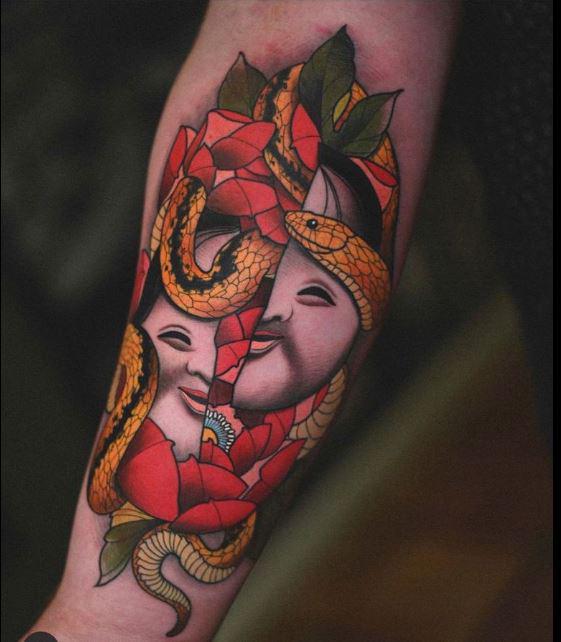 Okame and Snake on my right forearm. Done by Lorenzo Lopez of Folklore Trading Co. Dallas, TX