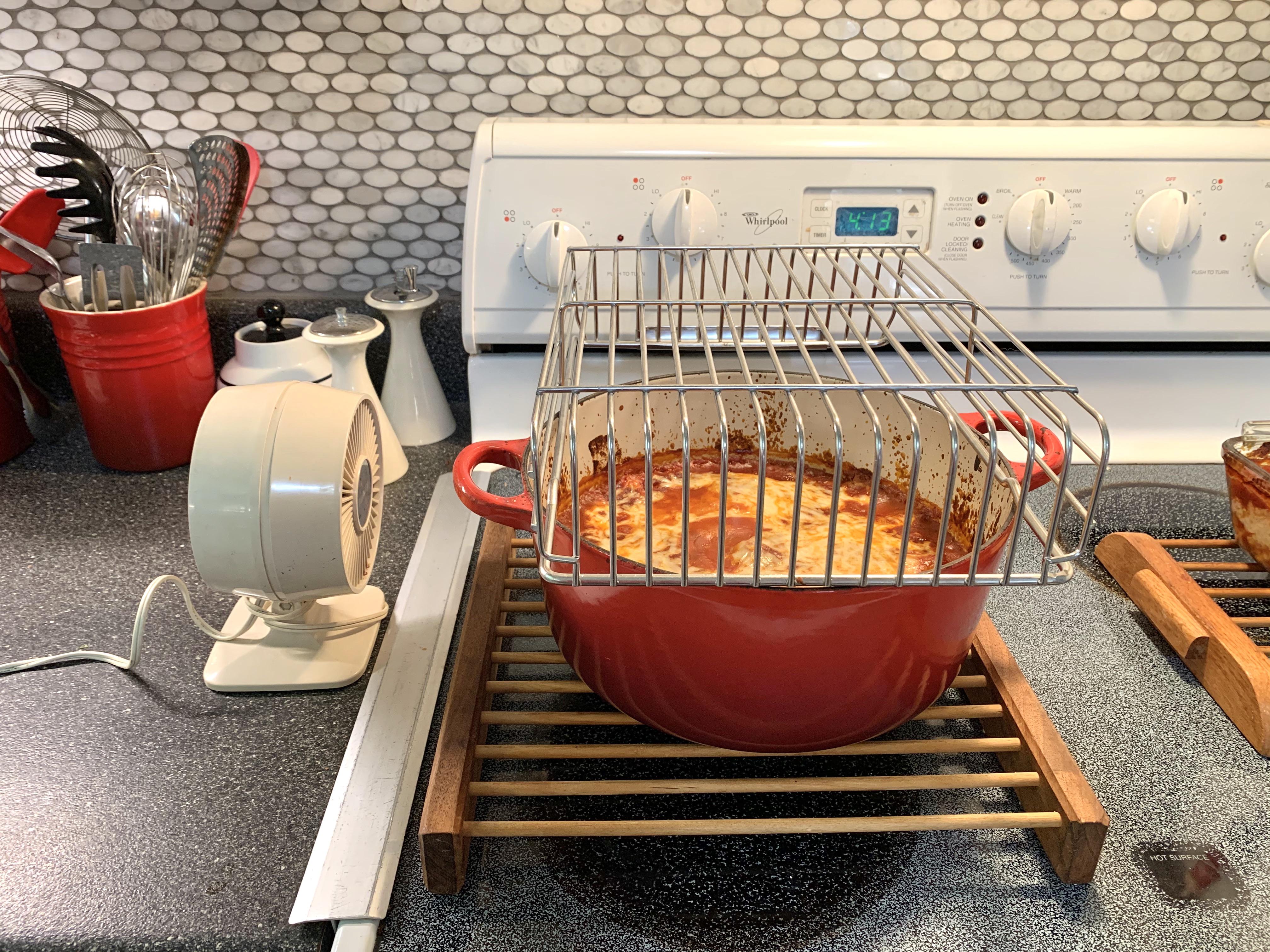 My Le Creuset cooling setup. The old wire fridge rack keeps the cat
