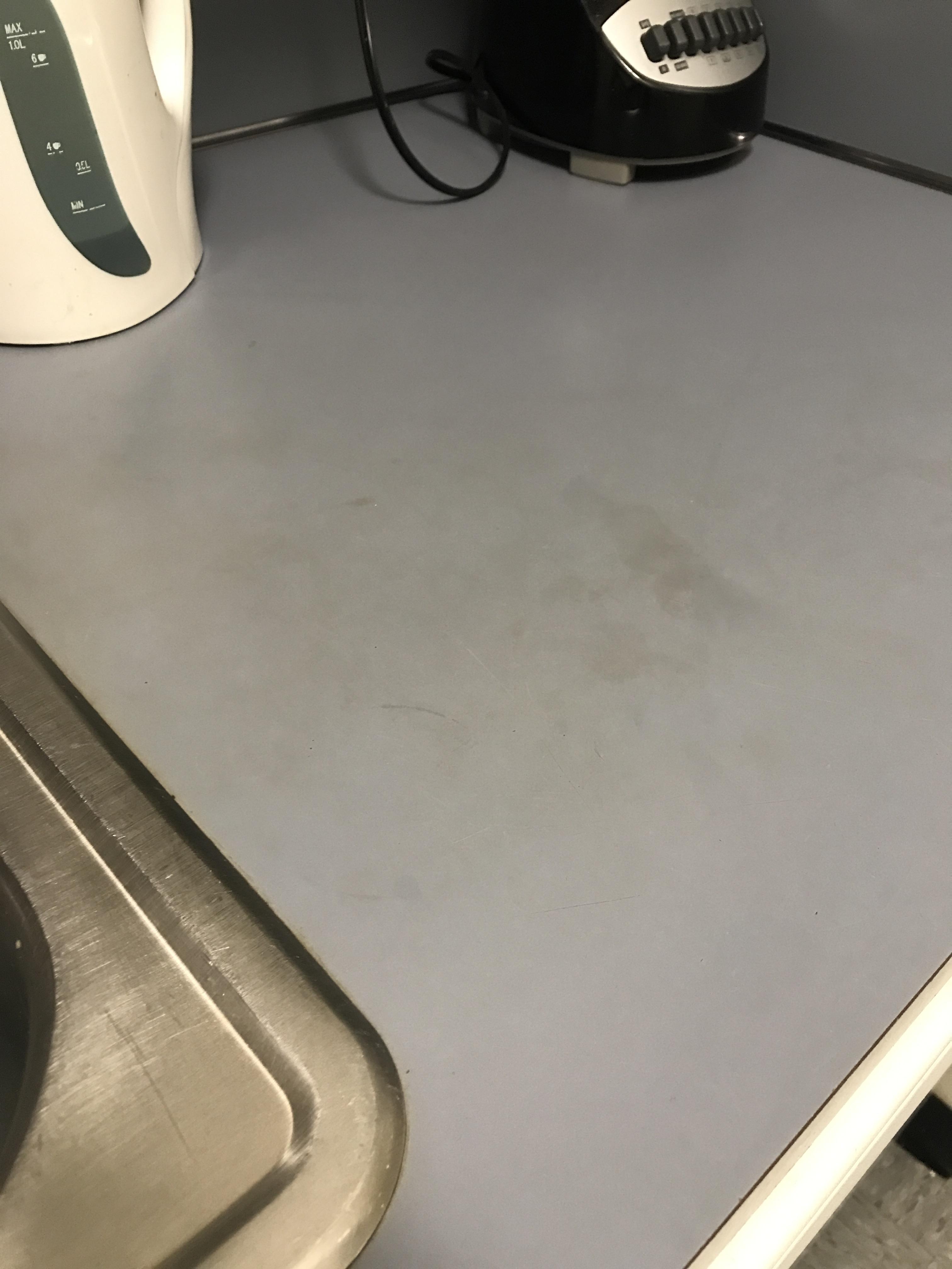 How would you clean these yellow spots from kitchen surface? r