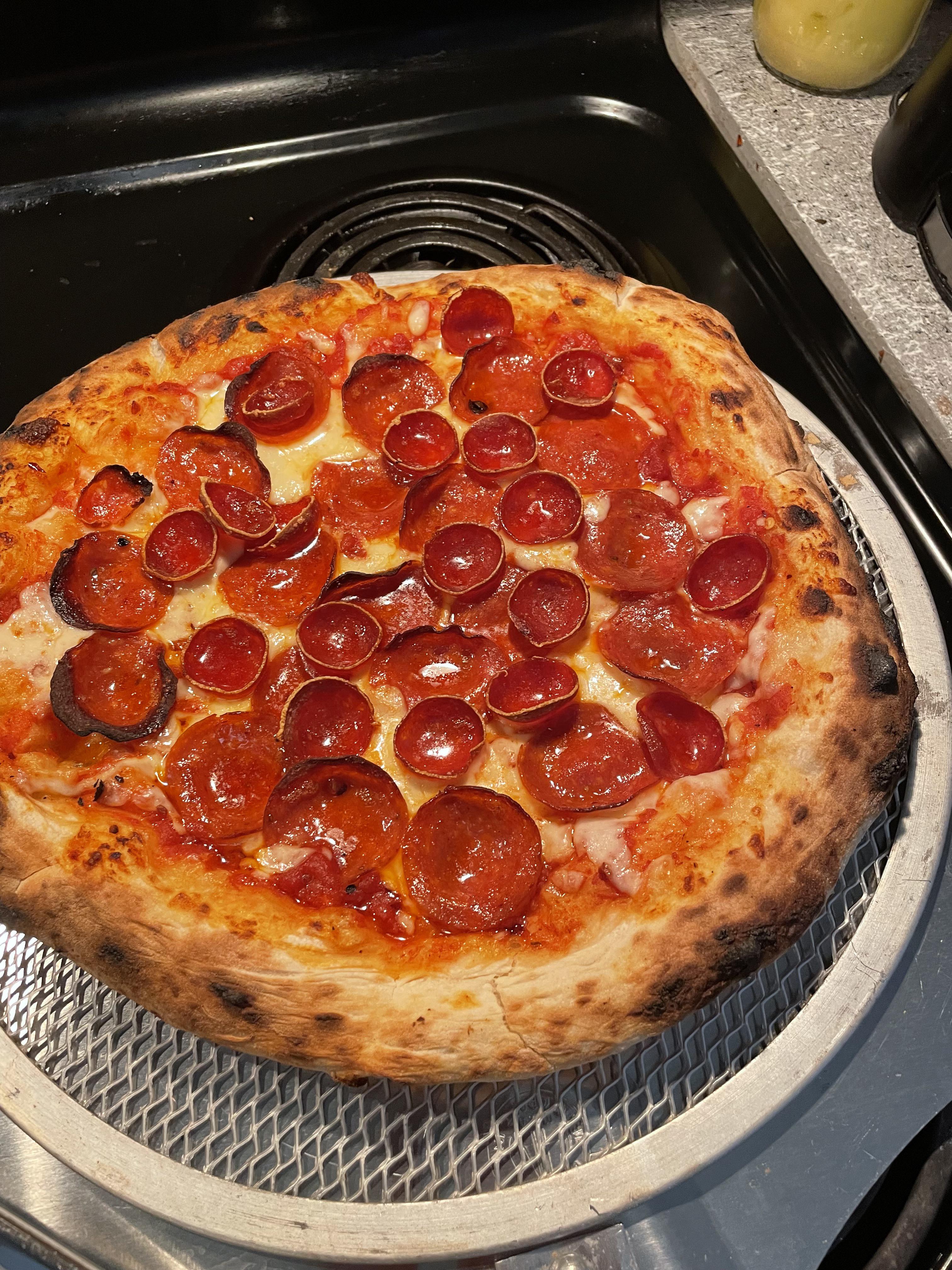 Kenji’s ny pizza dough recipe on an Ooni seriouseats