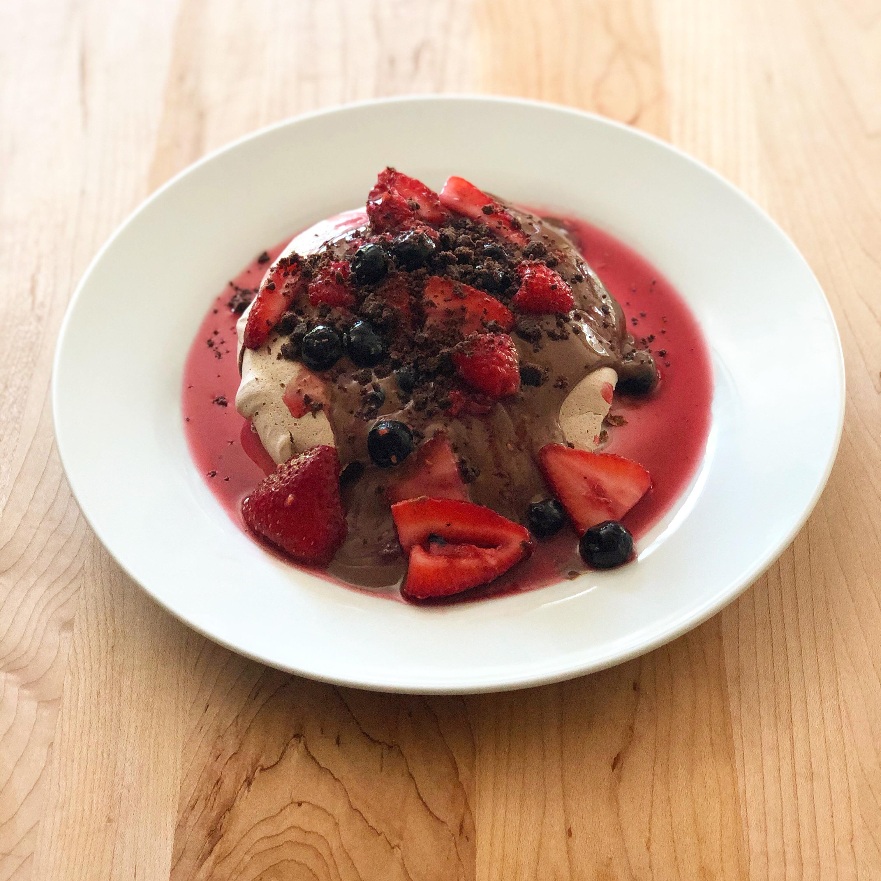 Chocolate pavlova with crèmeux, Cointreau macerated berries and