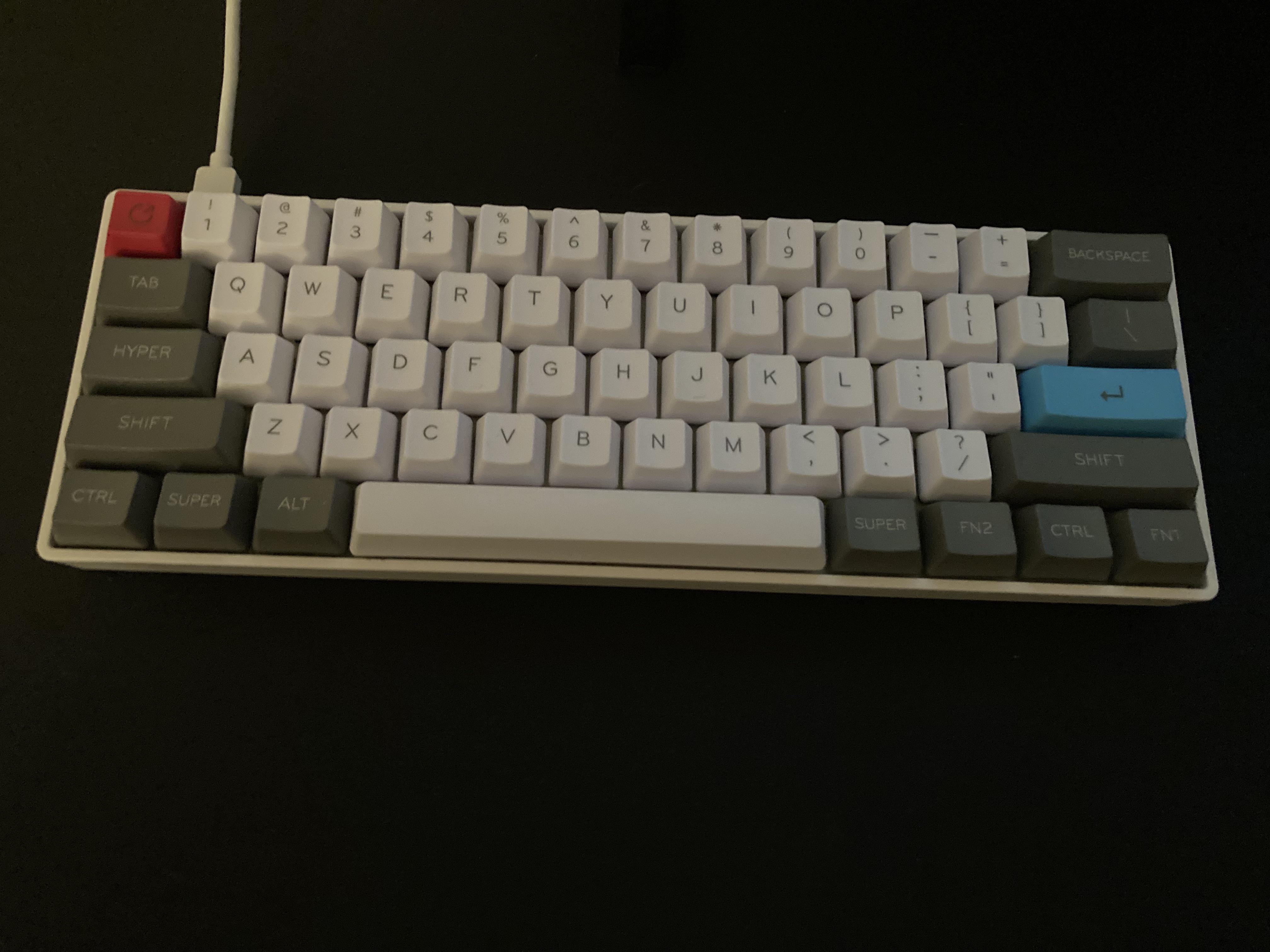It isn’t much, but it’s my first modded keeb. GK61 optical reds, new