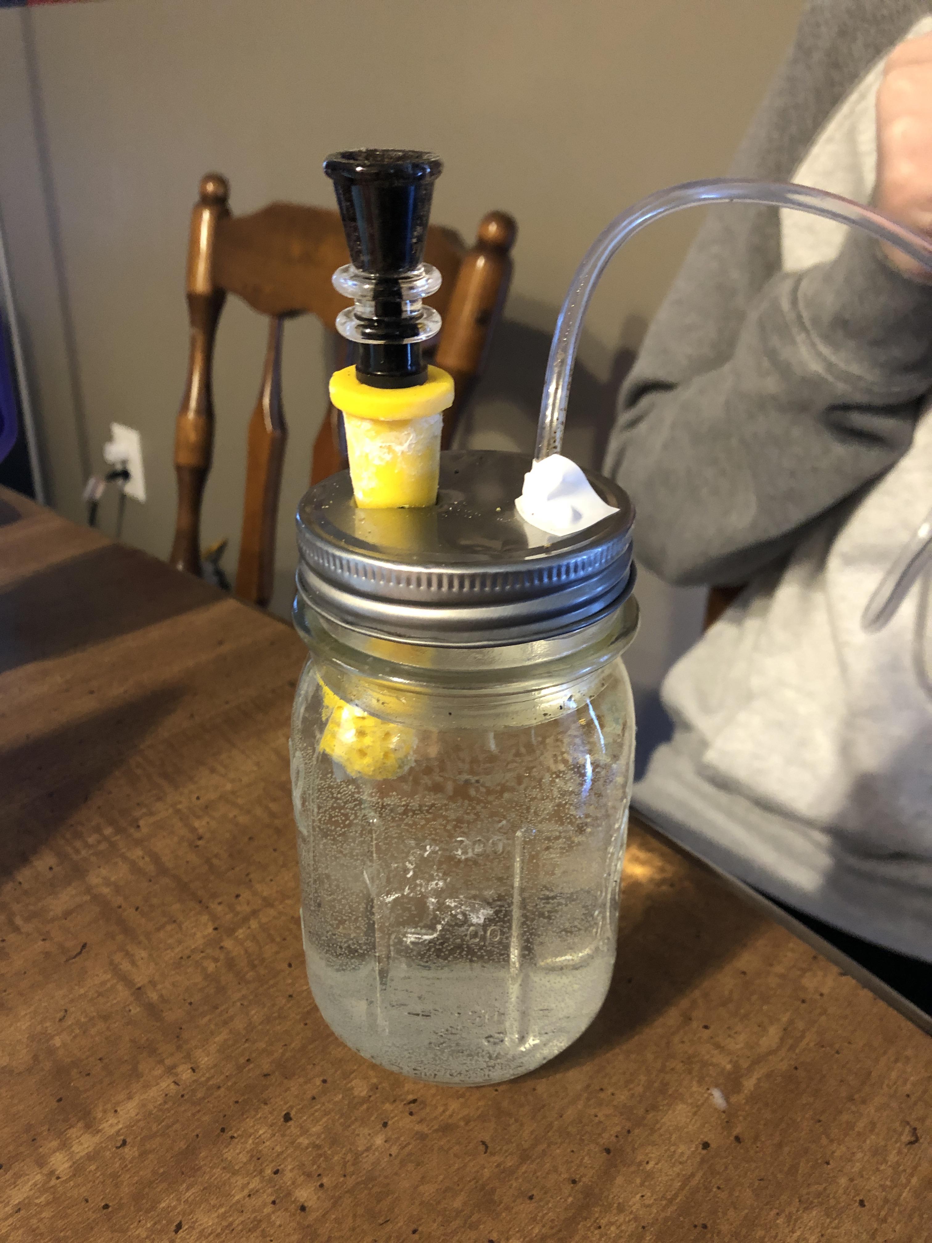 Small bubbler made from a mason jar, silicone downstem, vinyl tubing