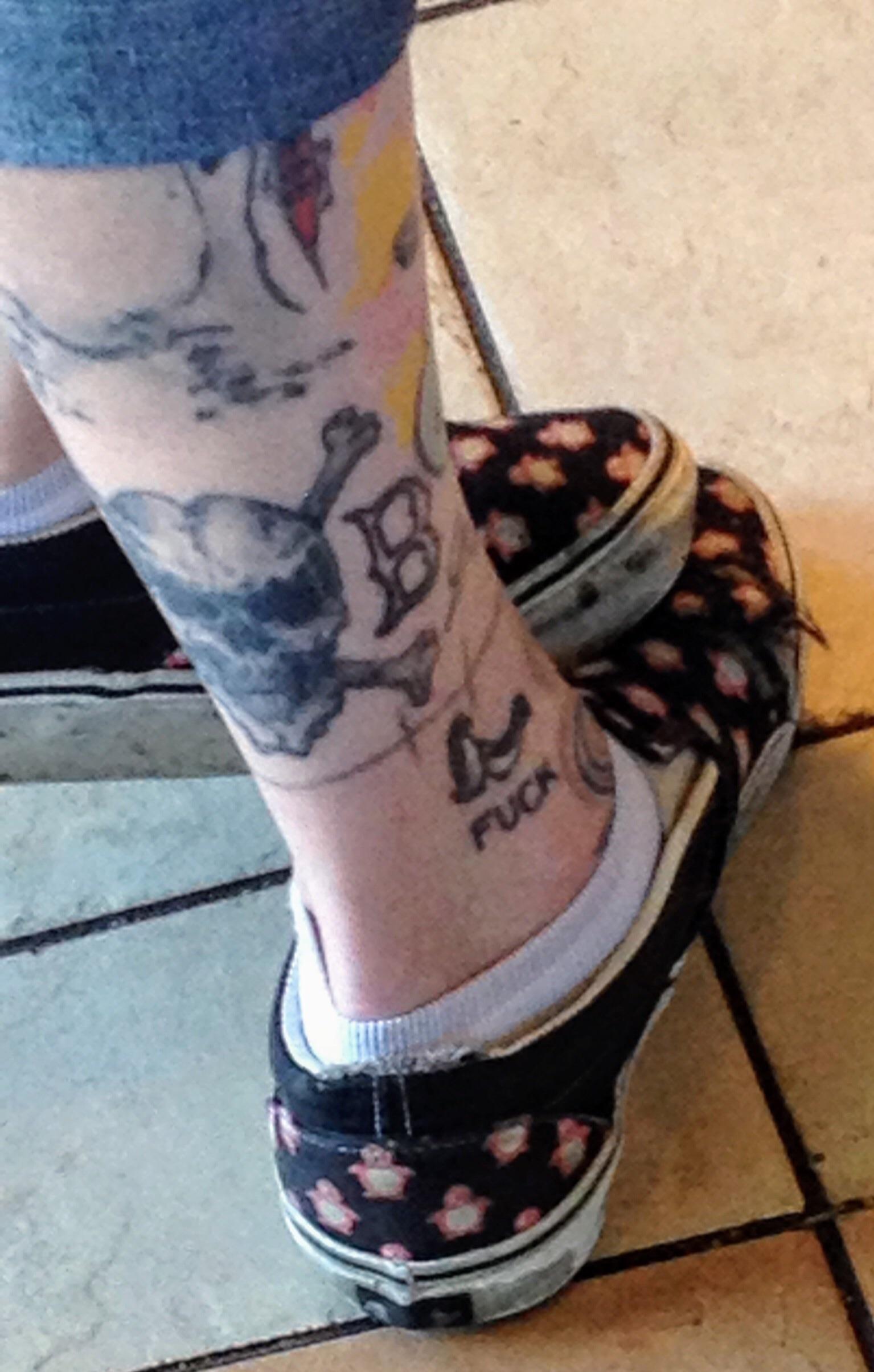 Penguin tattoo seen at a Starbucks in Boston trashy