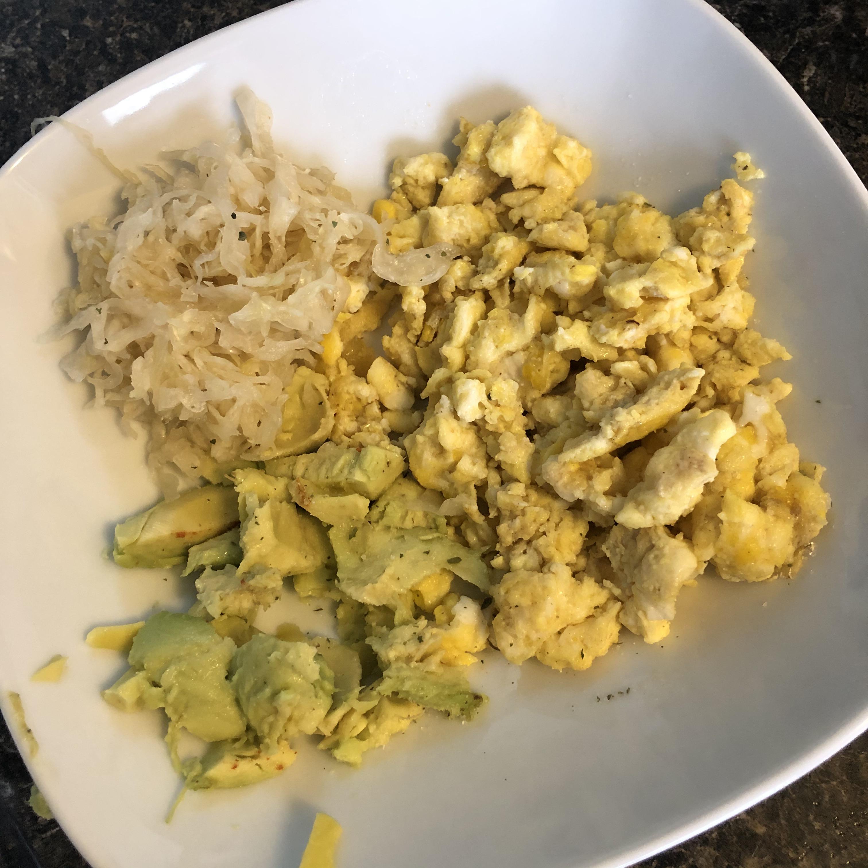 Favorite trio eggs, avocado, and sauerkraut sprinkled with garlic salt