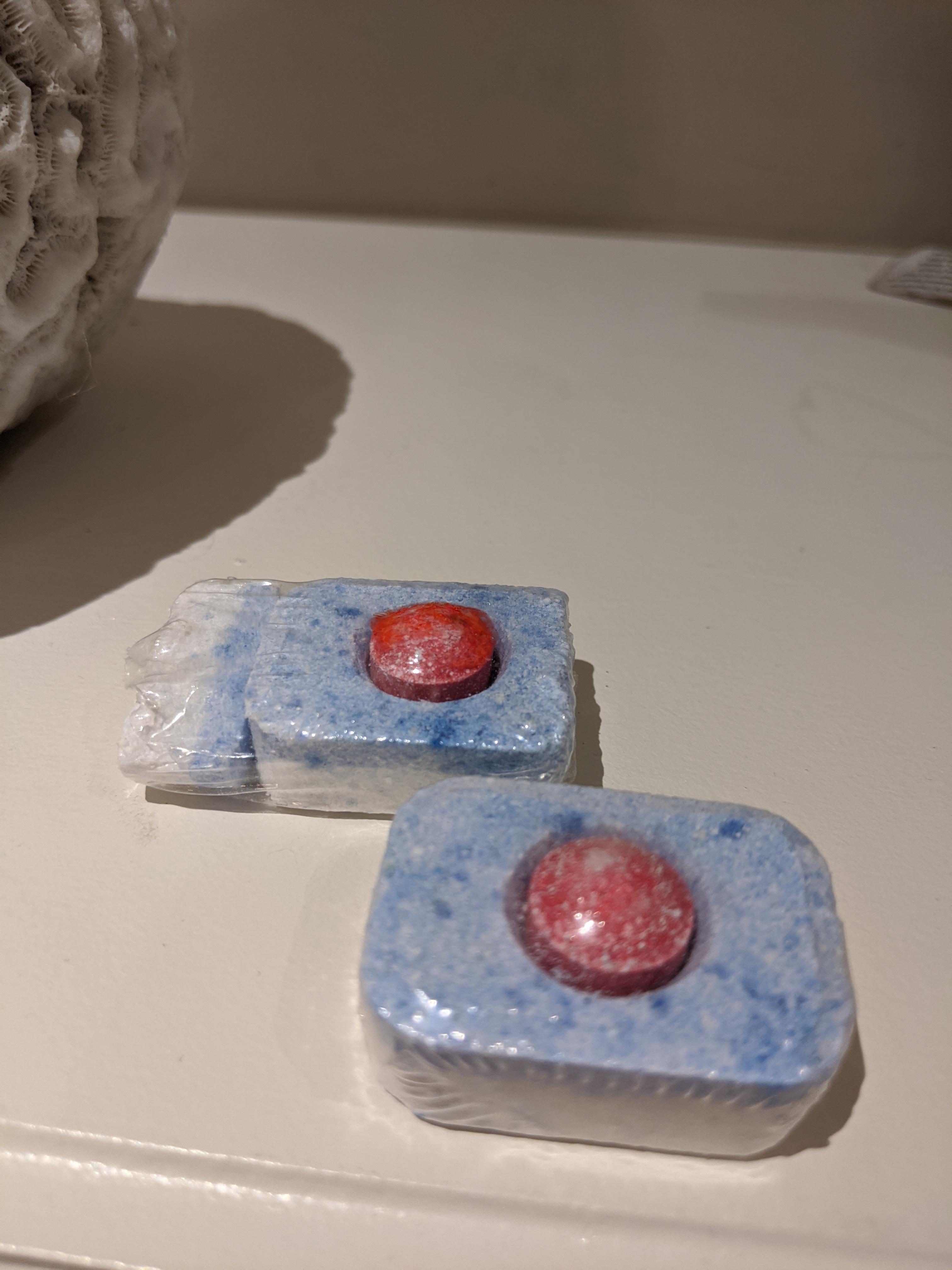 This dish detergent pod broke in two but was still wrapped together