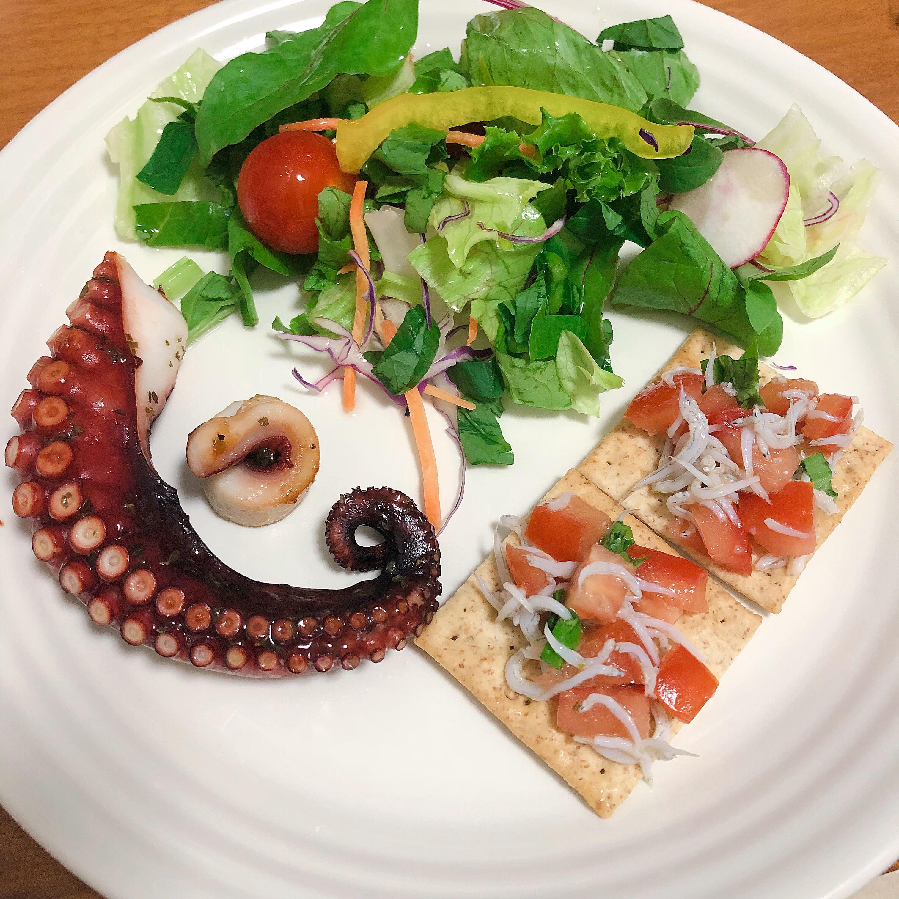 Mediterraneanstyle octopus with salad and marinated whitebait on