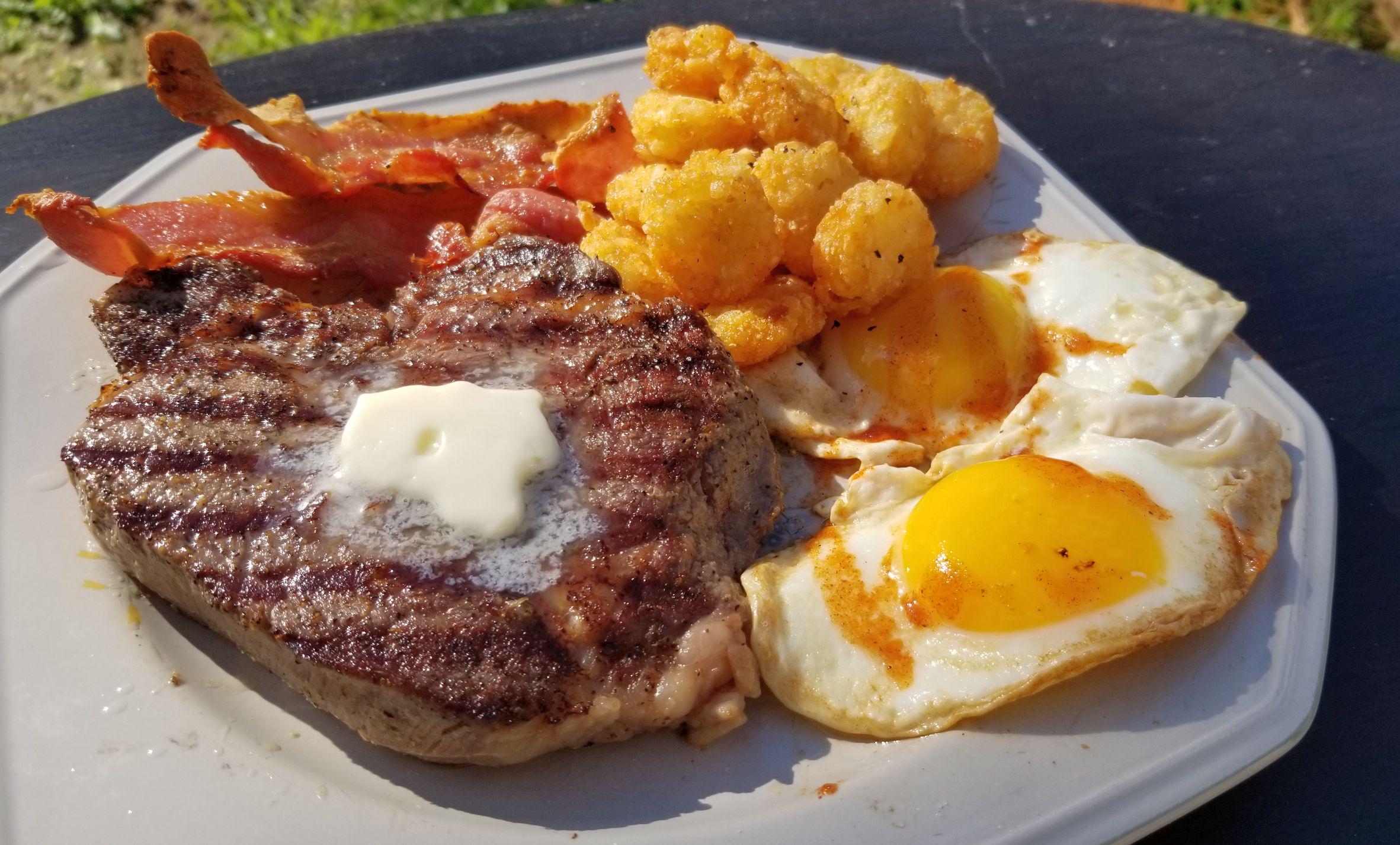 Is this OK to eatfor breakfast? Chuck eye steak, dry cured bacon, eggs, and flat tots fried