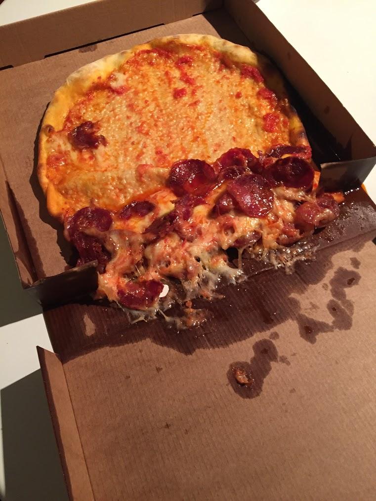 The pizza delivery guy stacked my pizza box on its side r