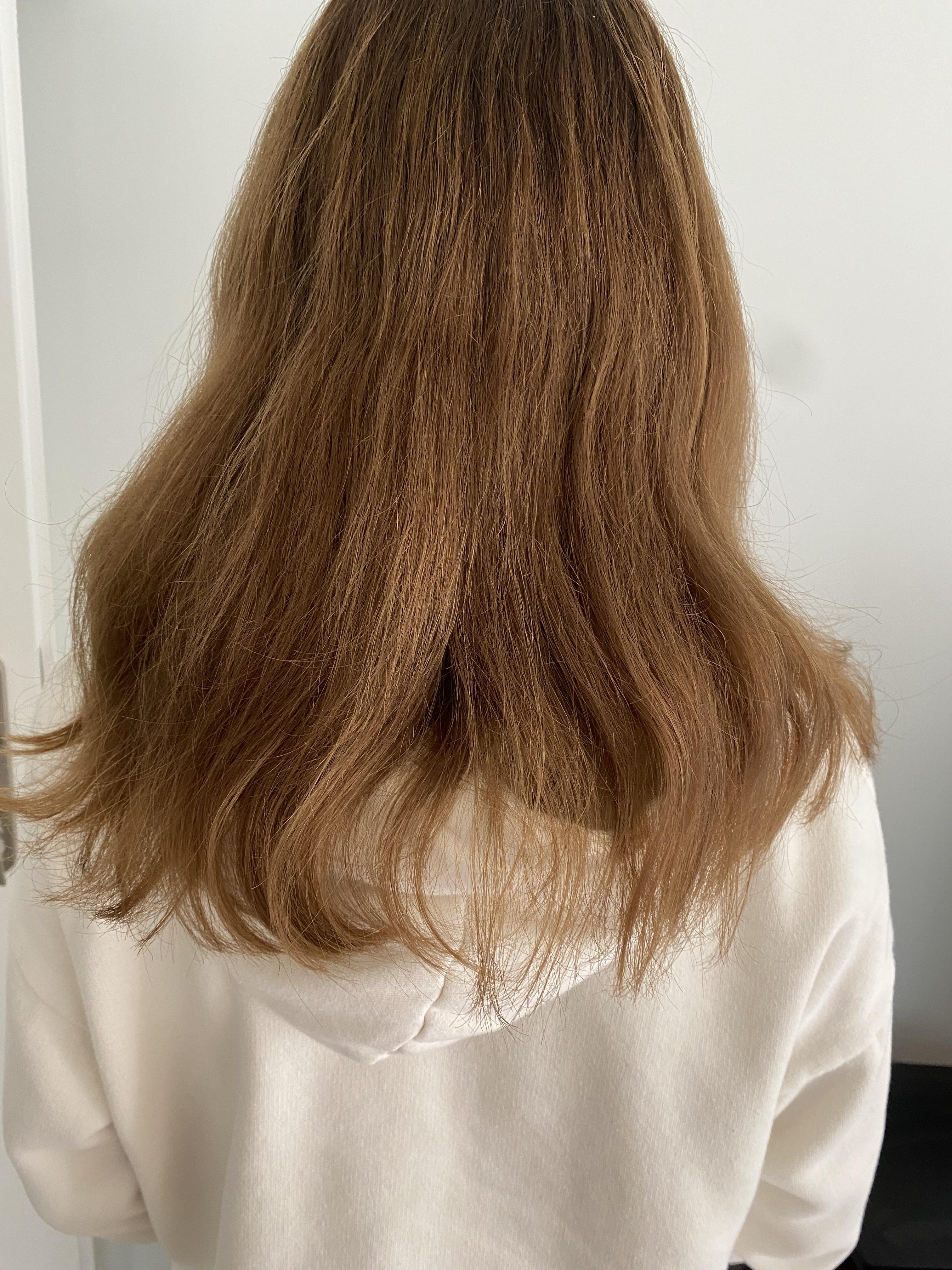 How can I make my hair look less dry? After washing it it looks even
