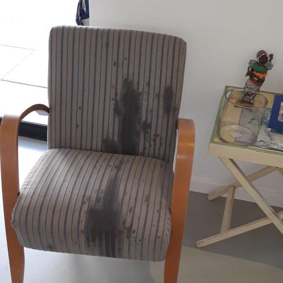 Help! I dropped a bottle of oil and it splattered all over my armchair