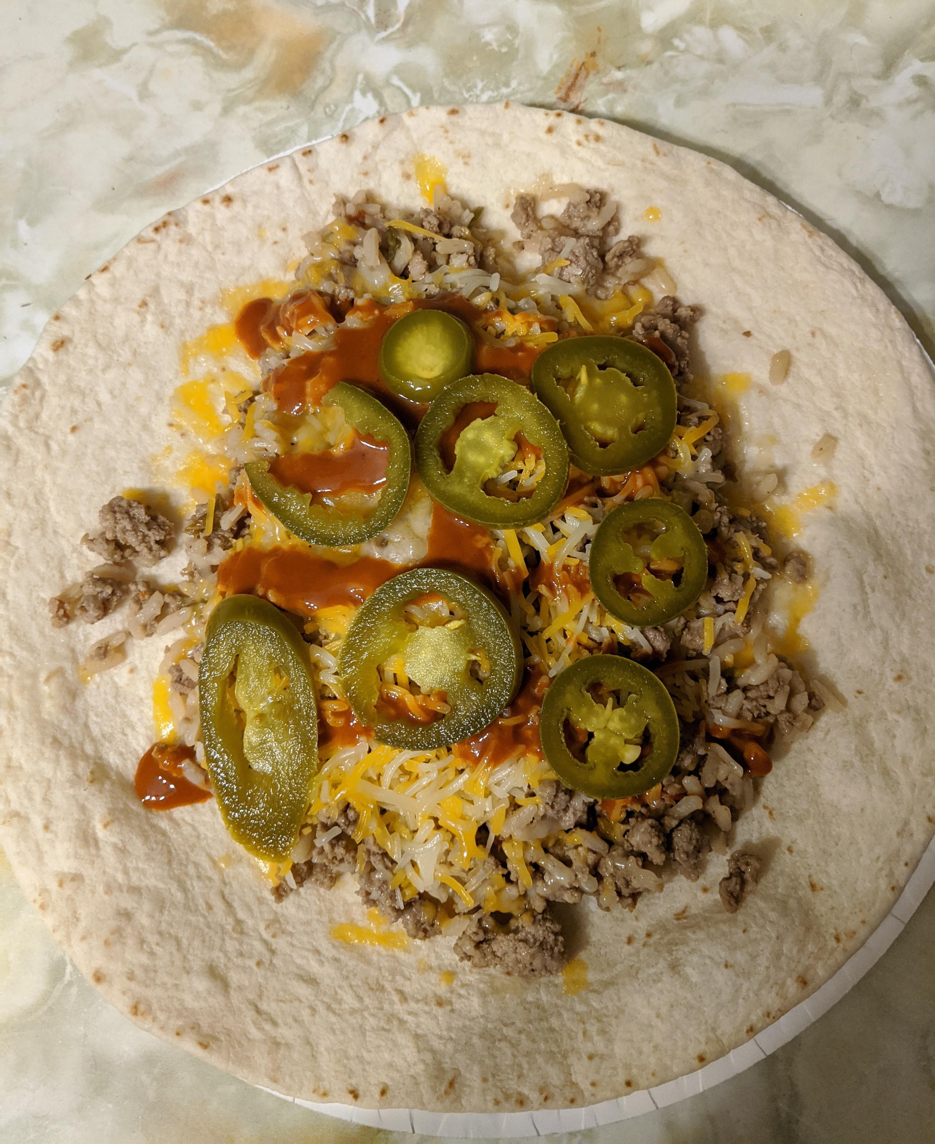 Packaged dirty rice burrito with extra hot valentinas r/shittyfoodporn