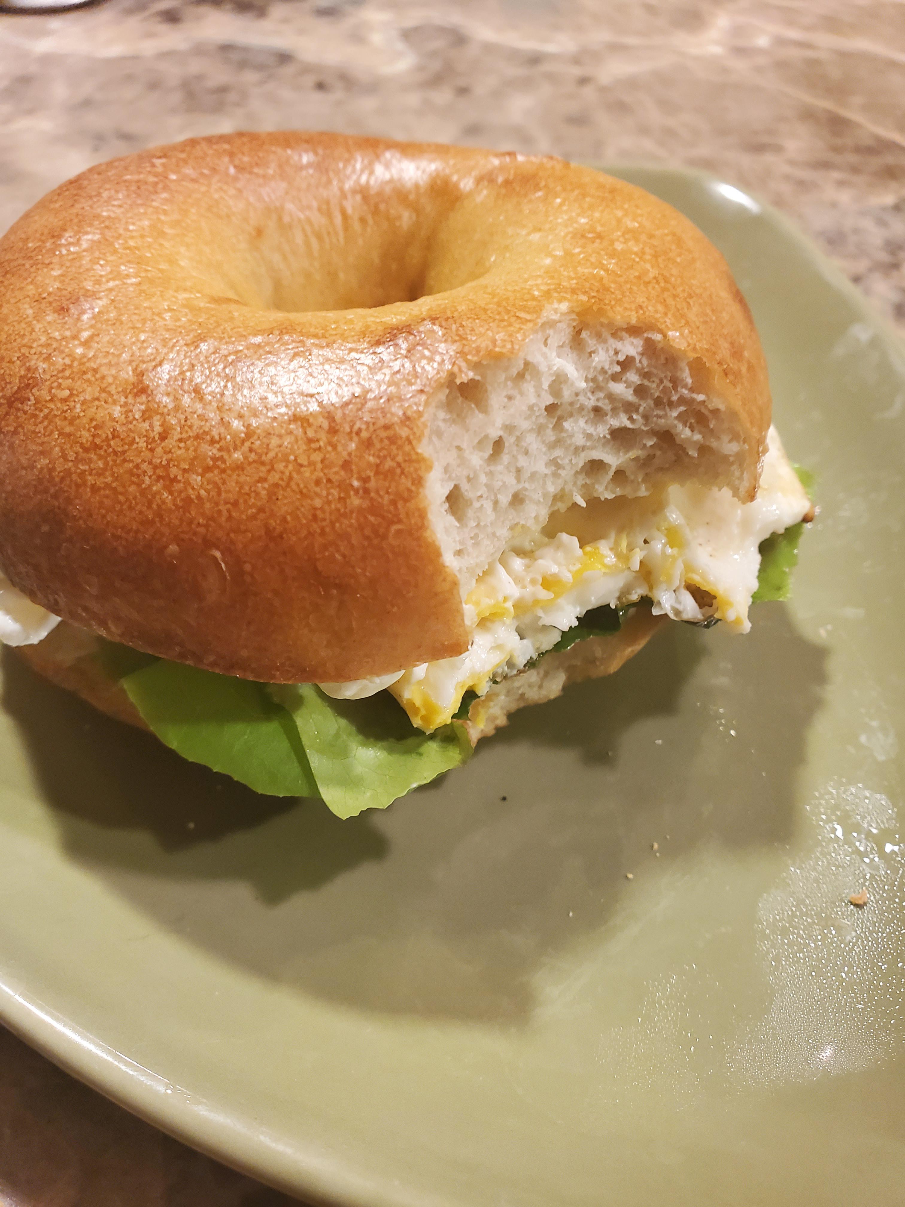 Egg sandwich on sourdough bagel with lettuce from my garden. All that's