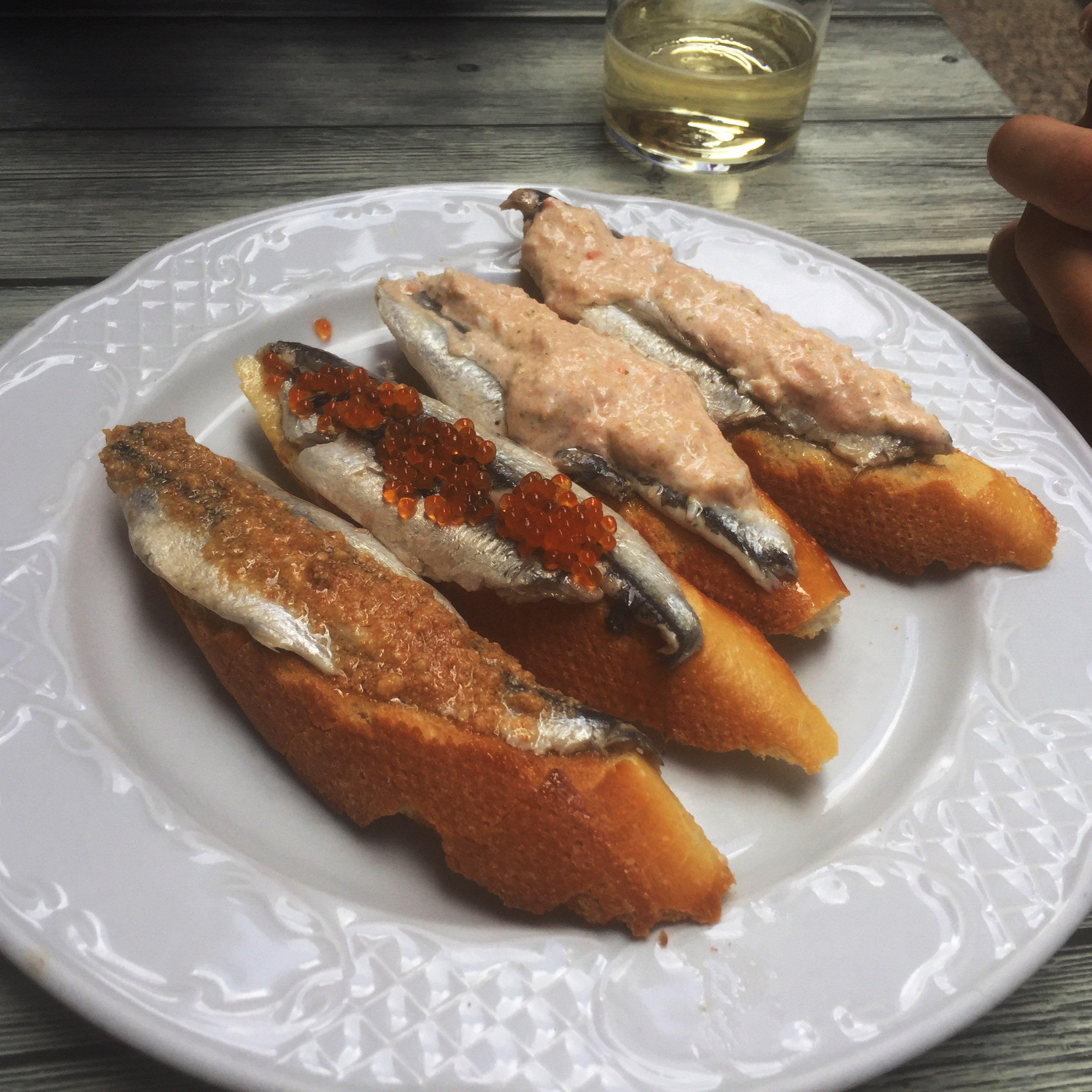 [i ate] marinated anchovies with sea urchin, trout roe, and crab