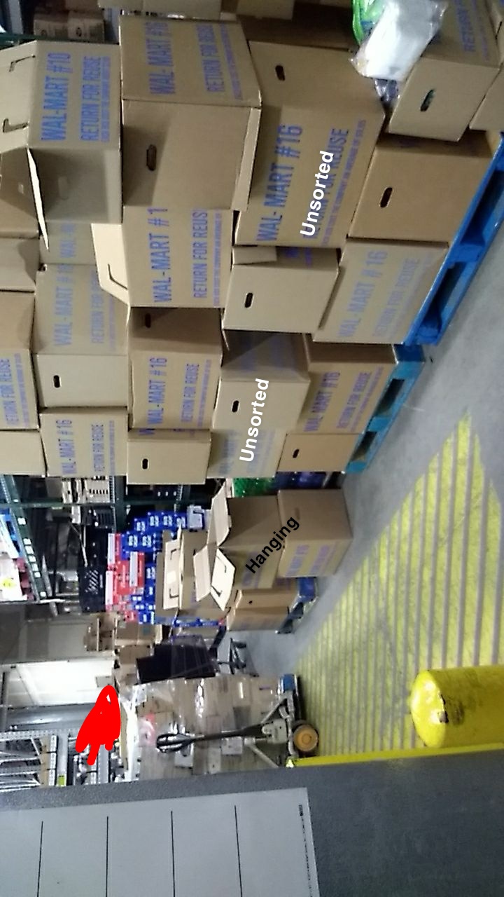 Sorting apparel in frobt of the coolers, because our backroom isnt big