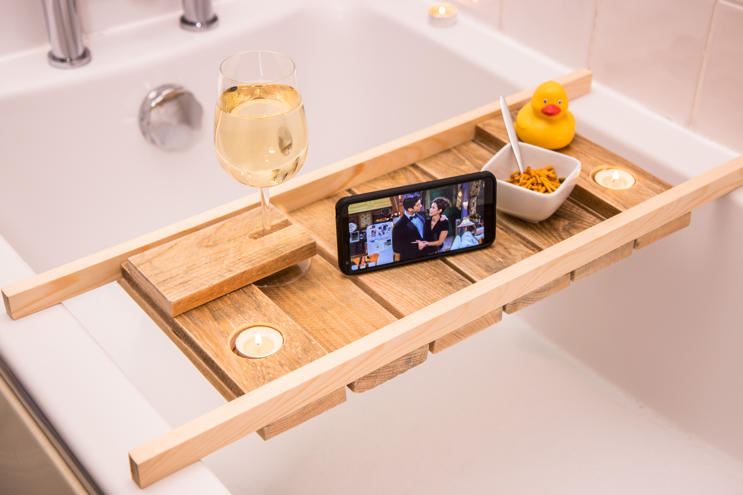 Made a bath caddy out of a pallet. With essential wine glass holder