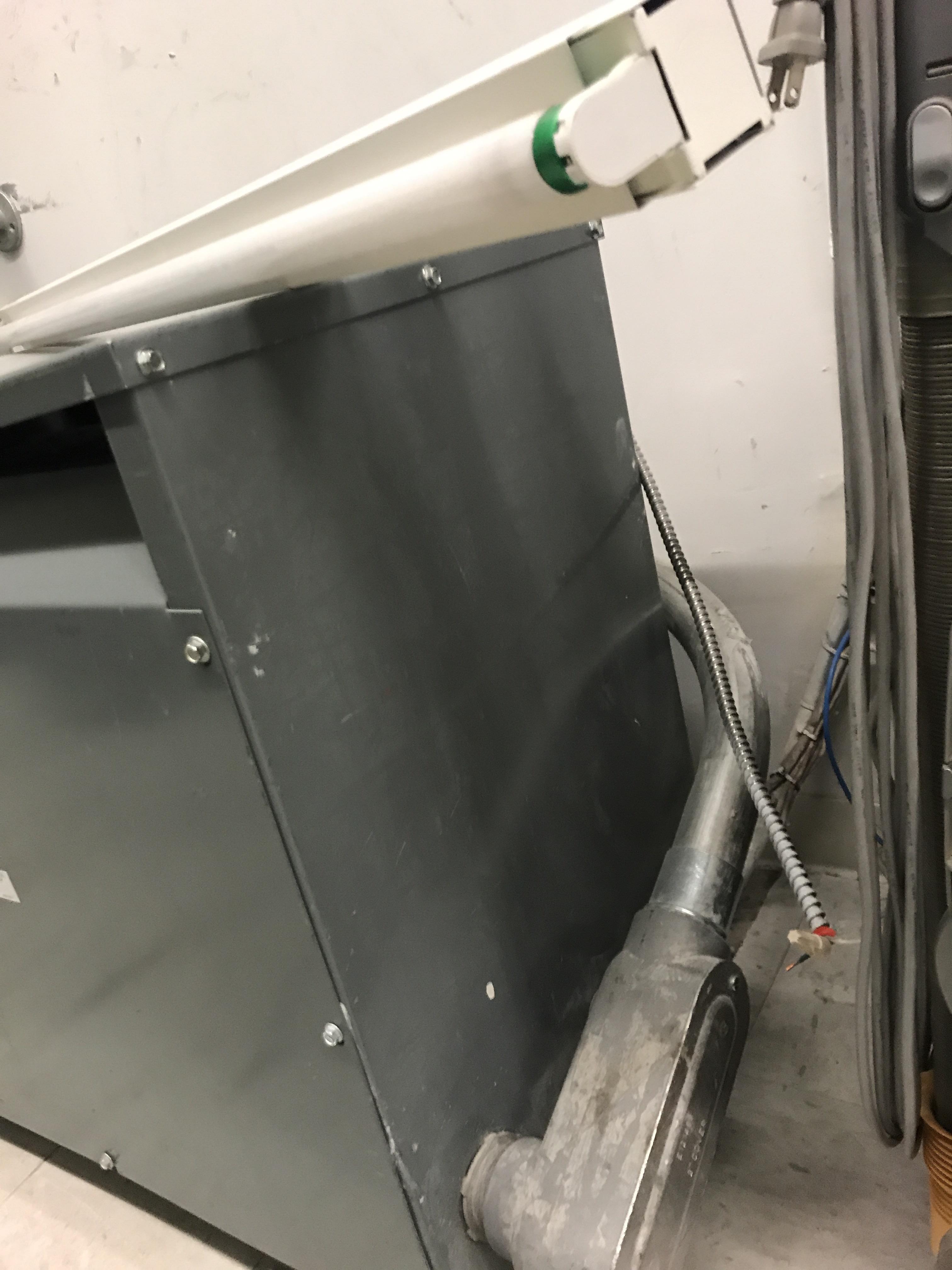 Exposed wiring for a florescent light next to a high voltage power