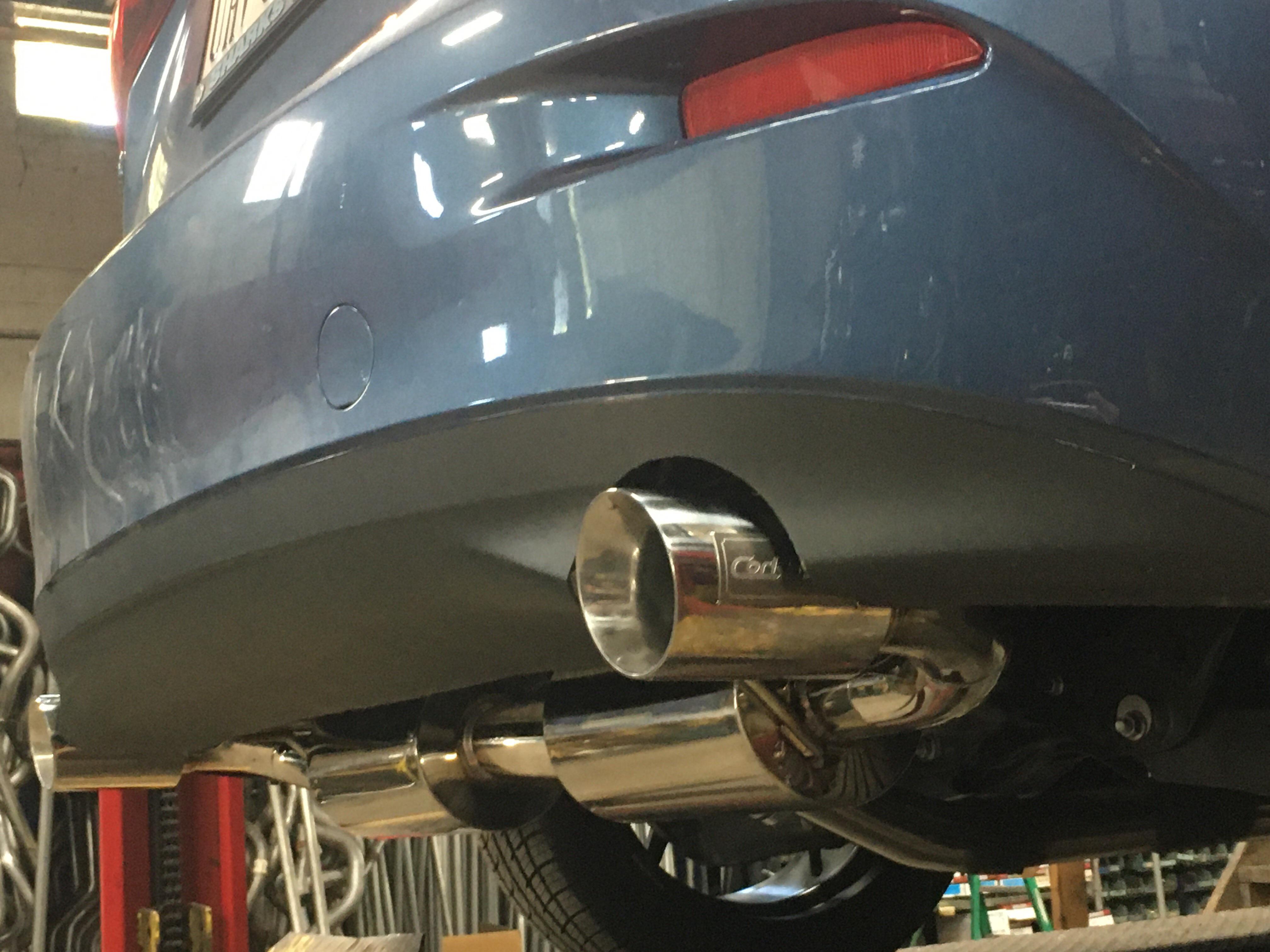 Coming down the lift Corksport CatBack w/ exposed tips on Gen 3 Sedan
