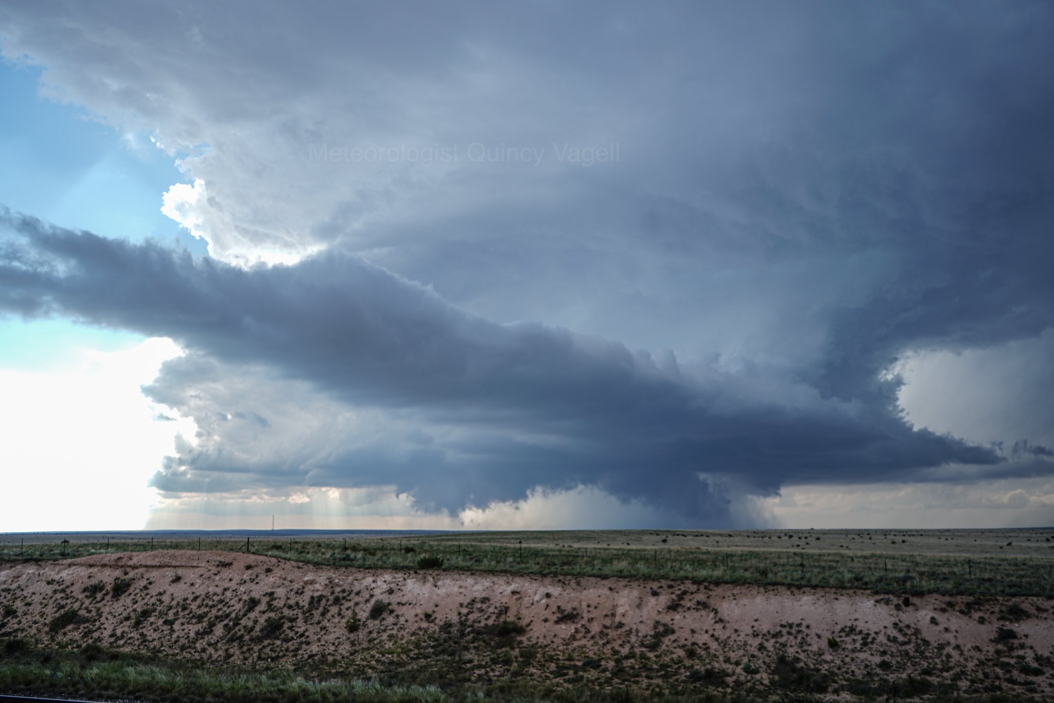 Funnel cloud lowering at 525 p.m. near Encino, NM. Wider perspective