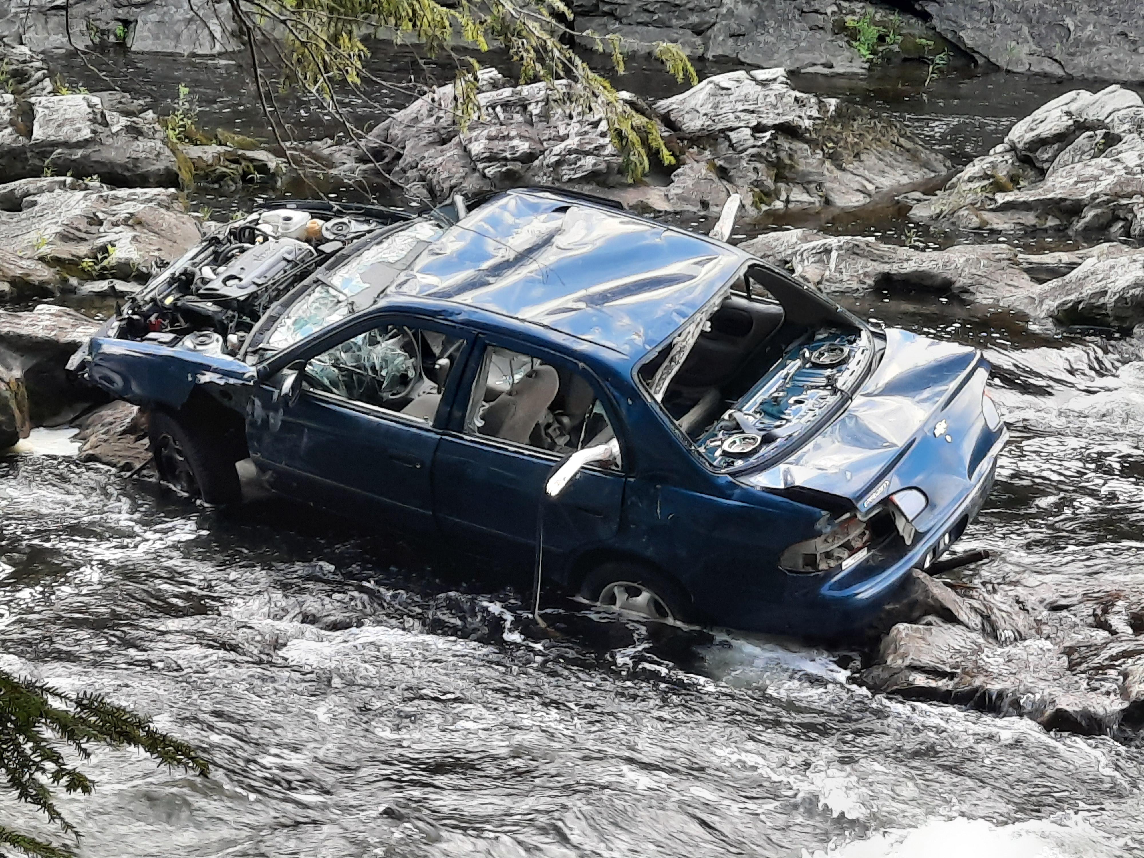 Abandoned car in river, Vermont. r/AbandonedPorn