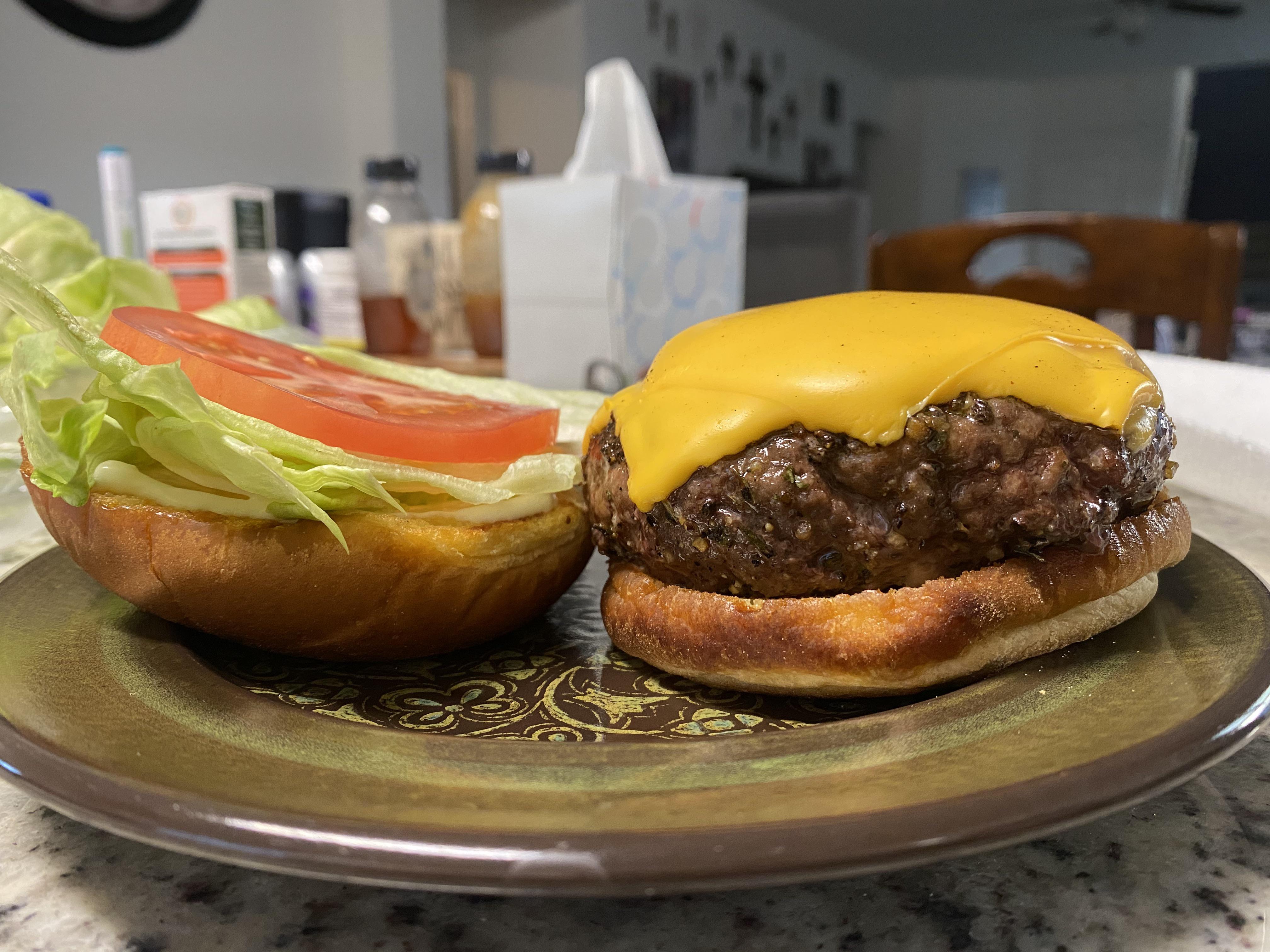 1/2 lb Brisket Cheeseburger. Preformed patty from HEB. Cooked on a gas