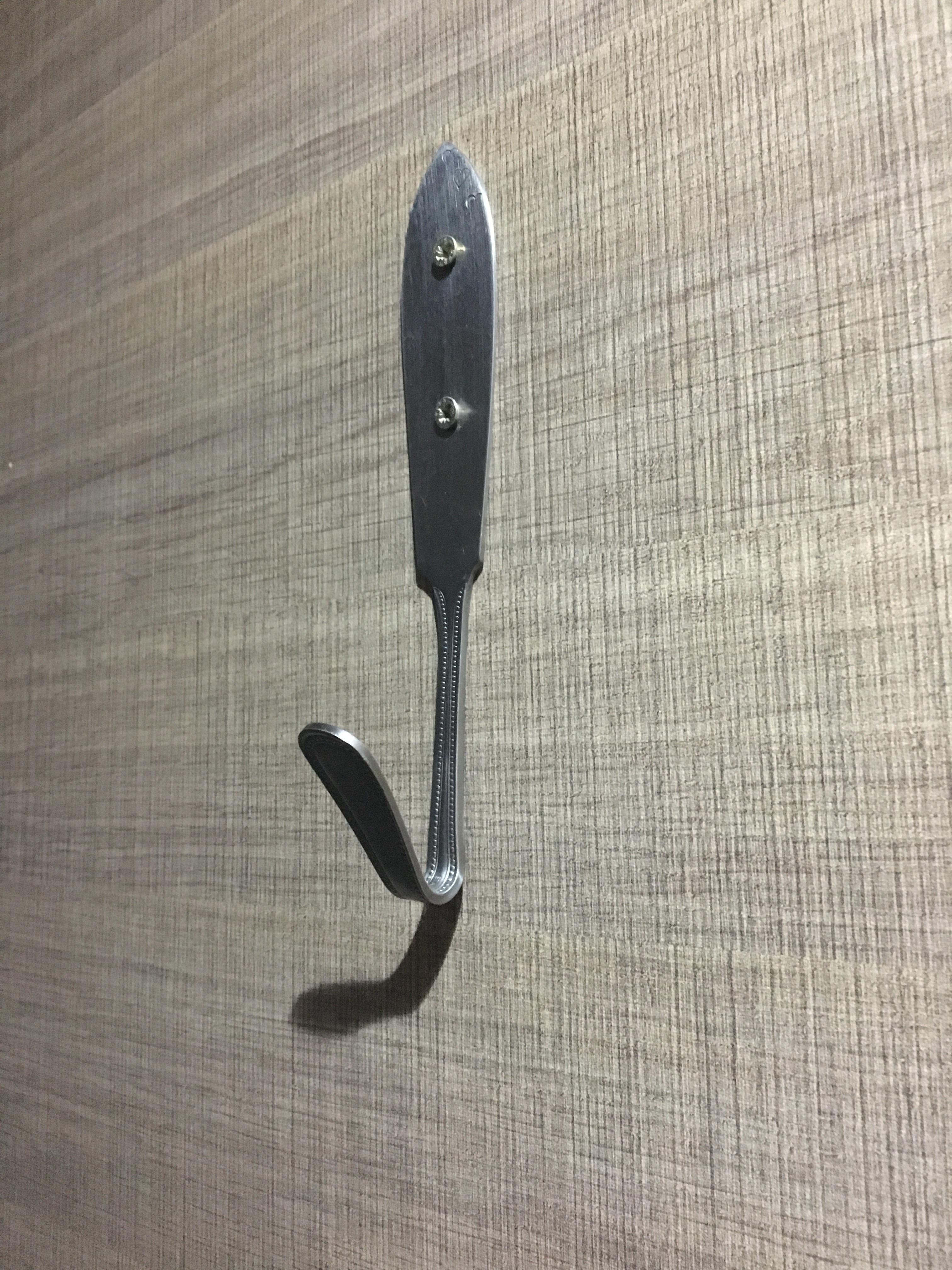 Just saw this coat hanger in a restaurant made from a modified cutlery