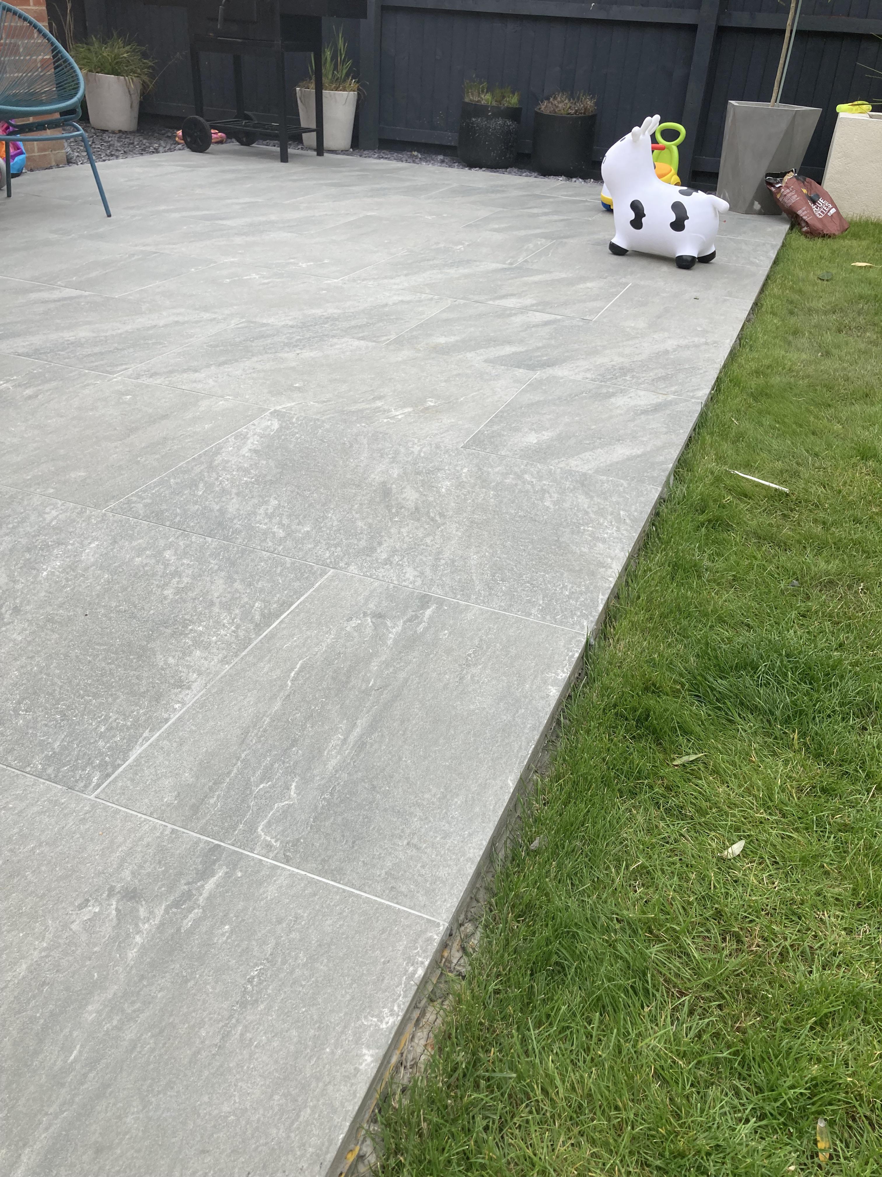 Best edging for this porcelain patio I just finished? Looking for