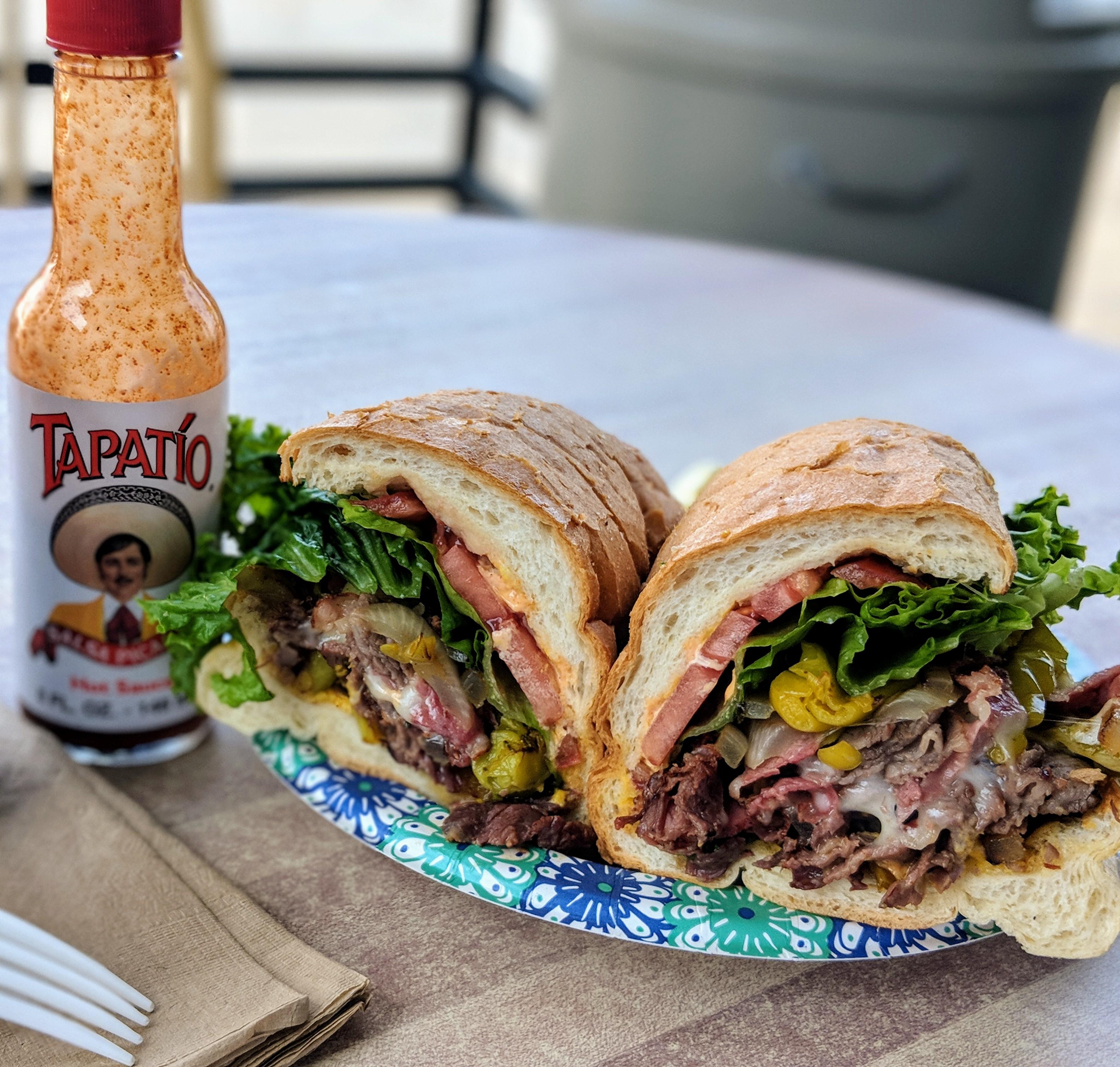 Tristrami Sandwich (thin cut tritip and pastrami on soft, flaky in