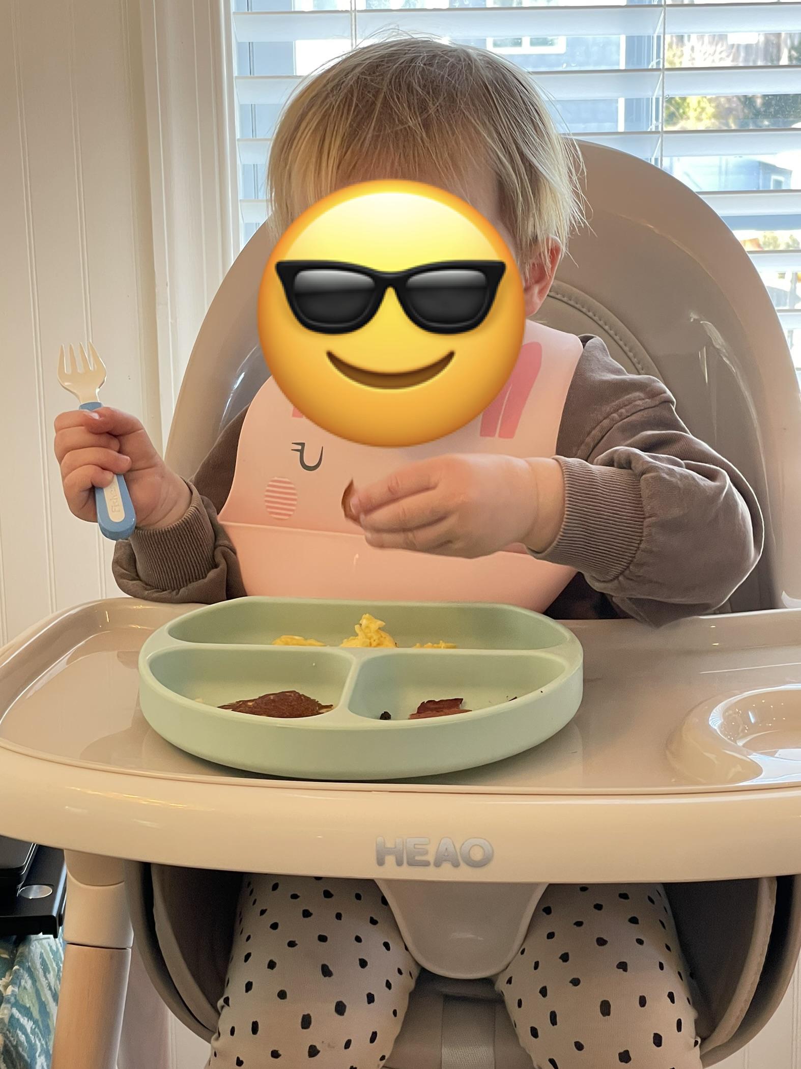 my 18th month old niece eating breakfast WOW eggs, bacon, pancakes ON