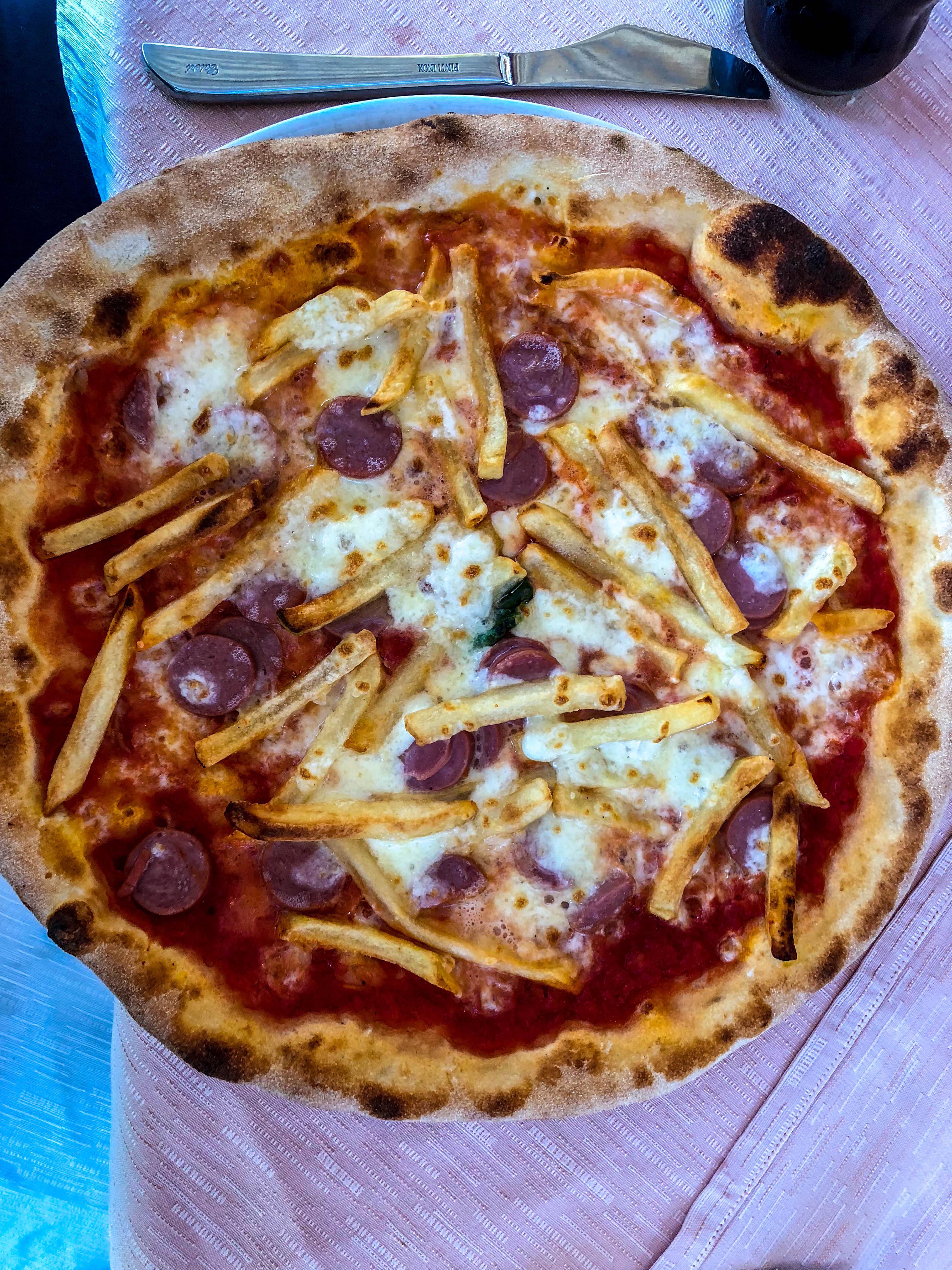 “American Pizza” with hot dogs and French fries in Pizzo, Italy r