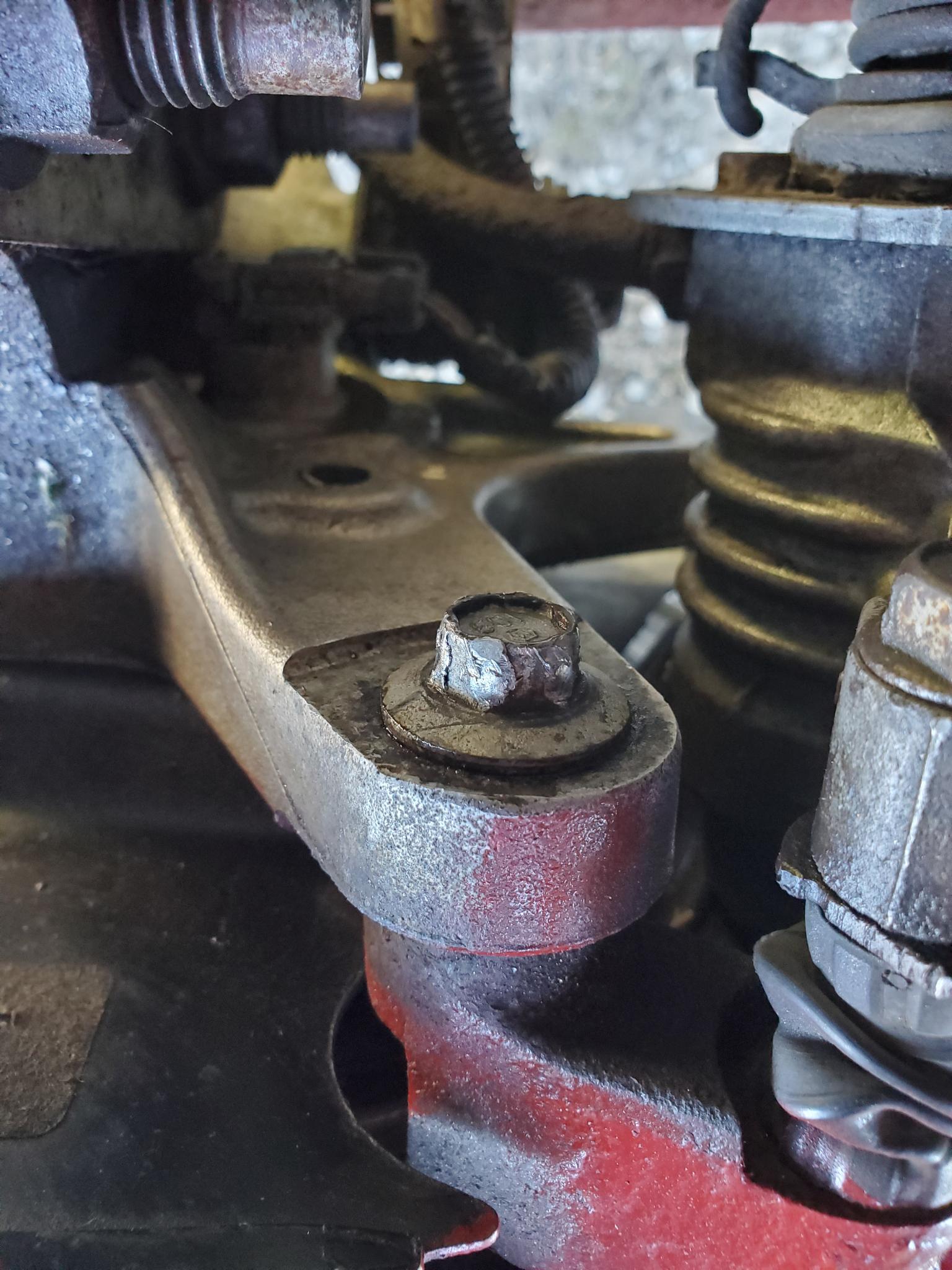 Ideas for removing this rounded off, insanely tight caliper bolt before
