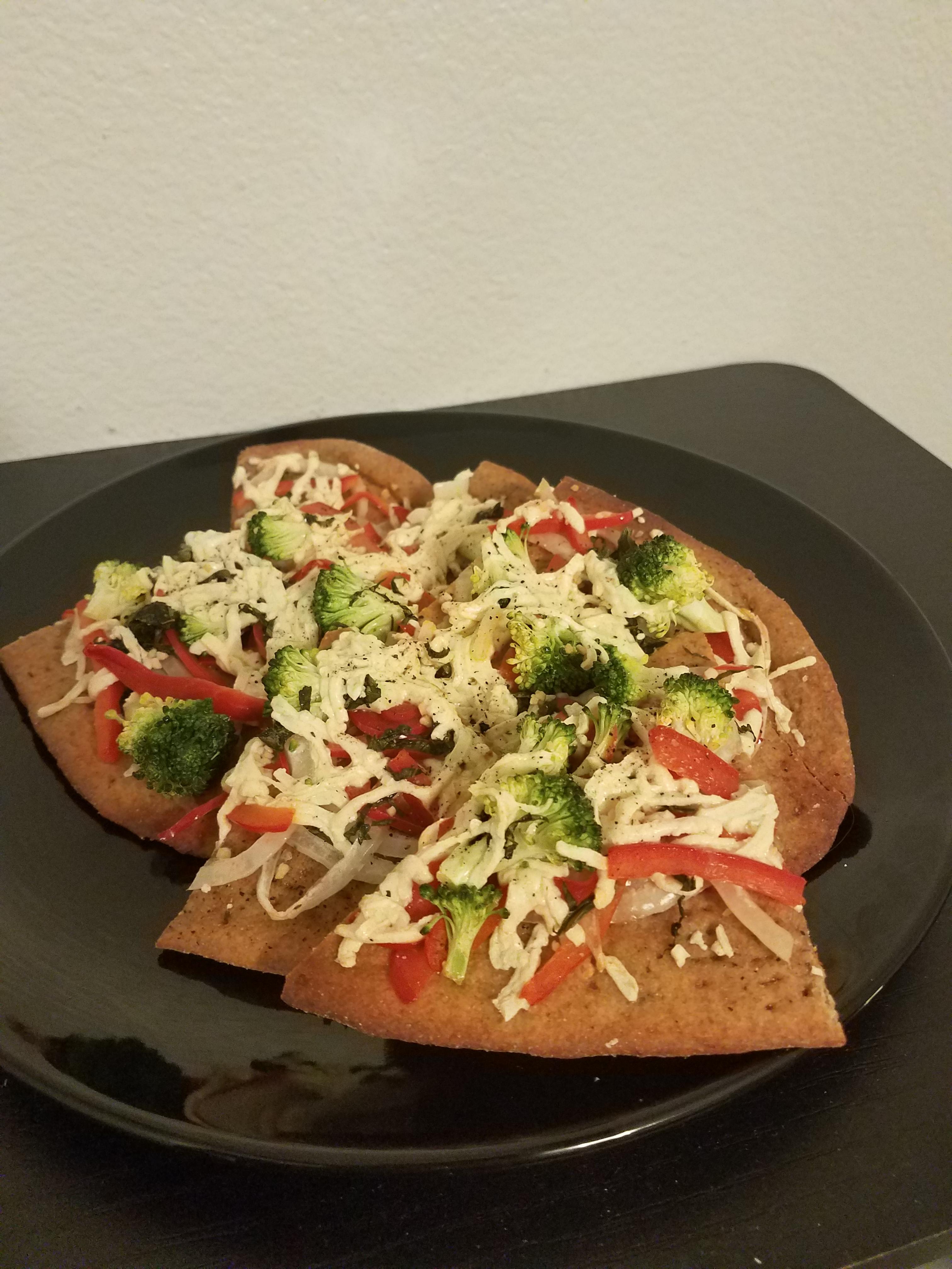 [Homemade] Whole wheat flatbread with garlic, black pepper and basil