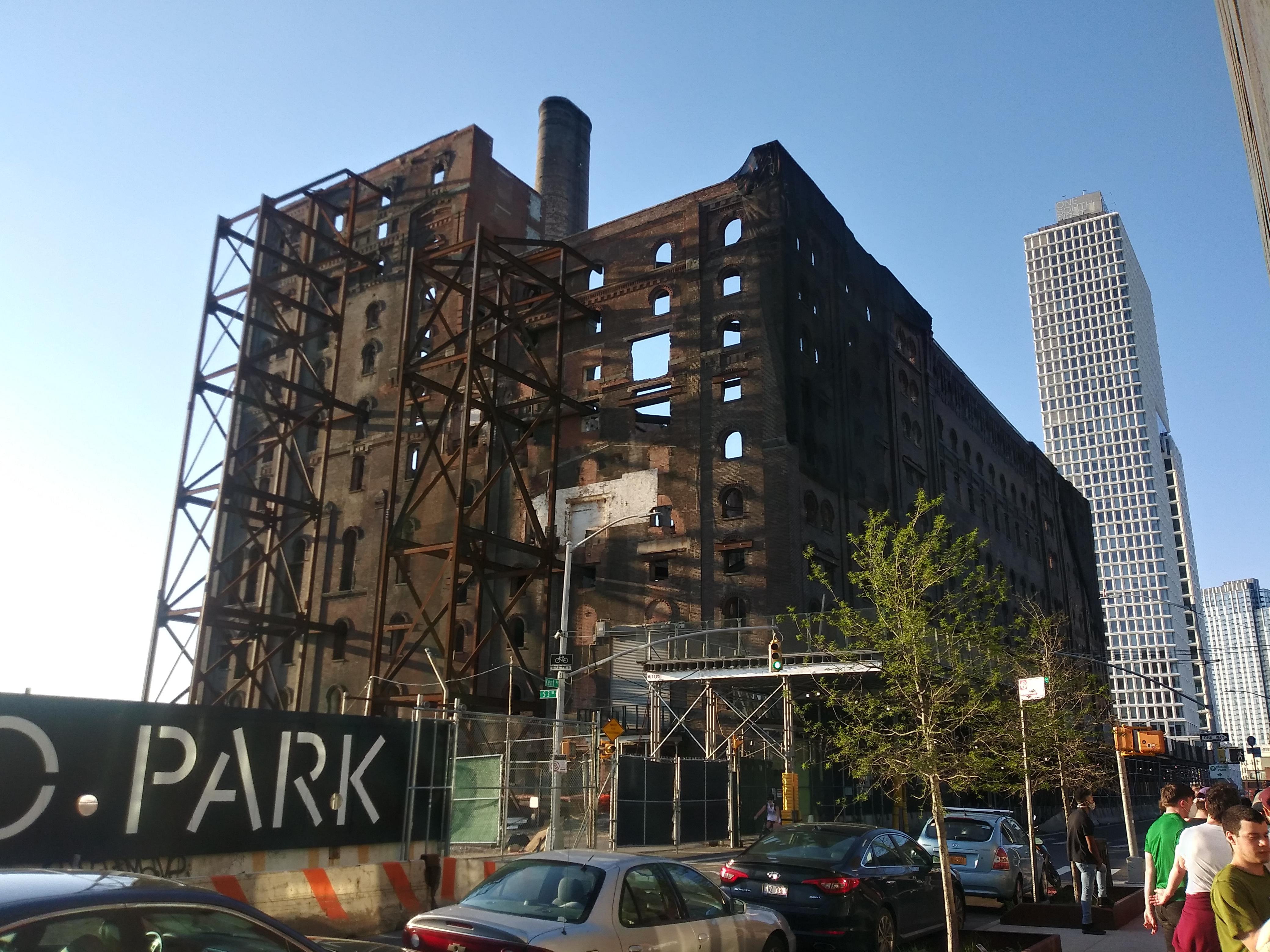 Factory building in Brooklyn, NY, completely gutted, but entire masonry facade being braced with